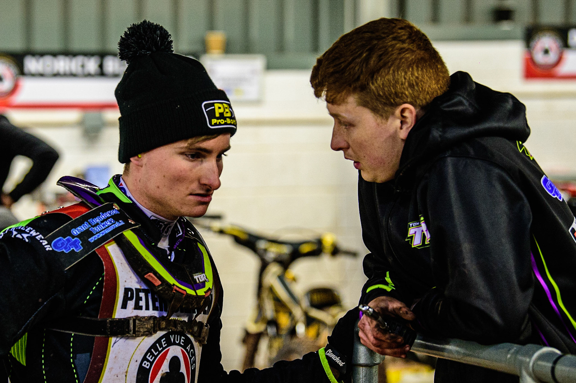 Tom Brennan  (left) chats with his mechanic  during the Peter Craven Memorial Trophy  at the National Speedway Stadium, Manchester on Monday 3rd April 2023. (Photo: Ian Charles | MI News)