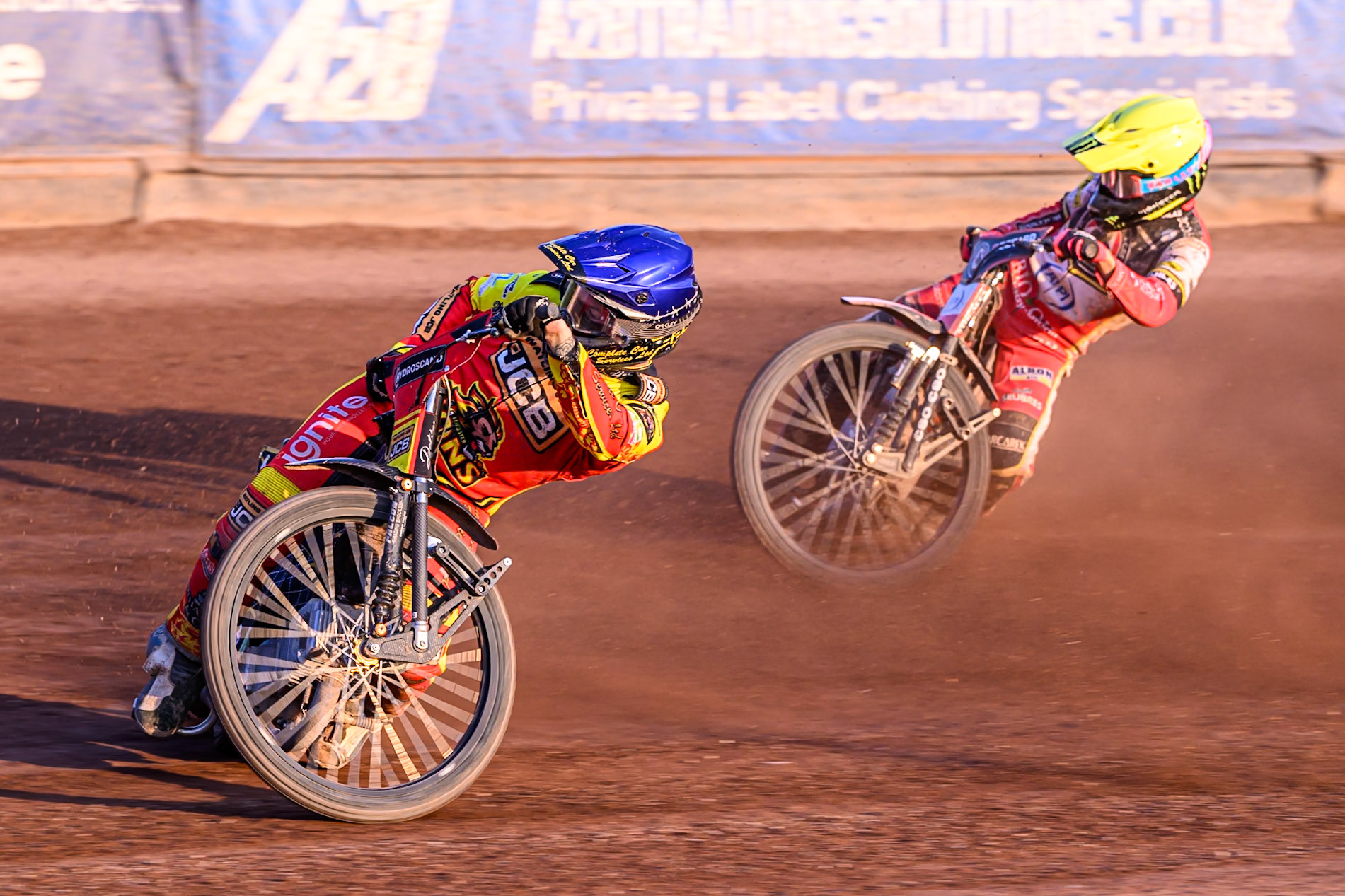 Leicester Lions' Kyle Howarth in Blue rides inside Belle Vue Aces' Dan Bewley in Yellow during the Rowe Motor Oil Premiership match between Leicester Lions and Belle Vue Aces at the Hydroscand Arena, Leicester on Thursday 19th June 2025. (Photo: Ian Charles | MI News)