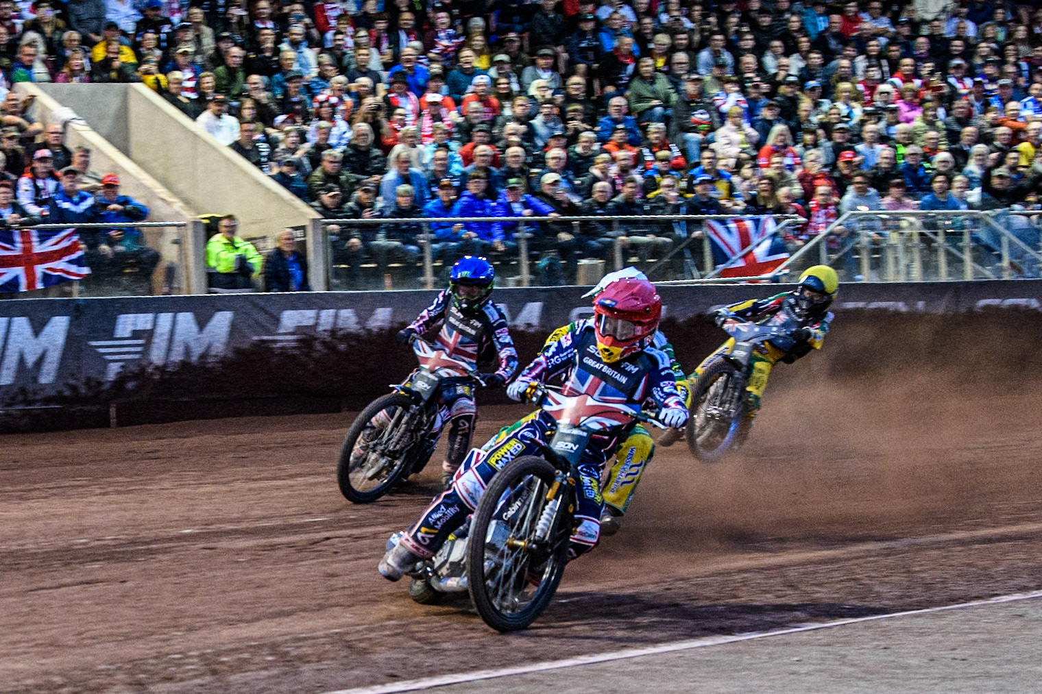 The final as Robert Lambert of Great Britain in Red leading \Jack Holder of Australia in White, Dan Bewley of Great Britain in Blue and Brady Kurtz of Australia in Yellow into the first turn during the Monster Energy FIM Speedway of Nation Final at the National Speedway Stadium, Manchester on Saturday 13th July 2024. (Photo: Ian Charles | MI News)