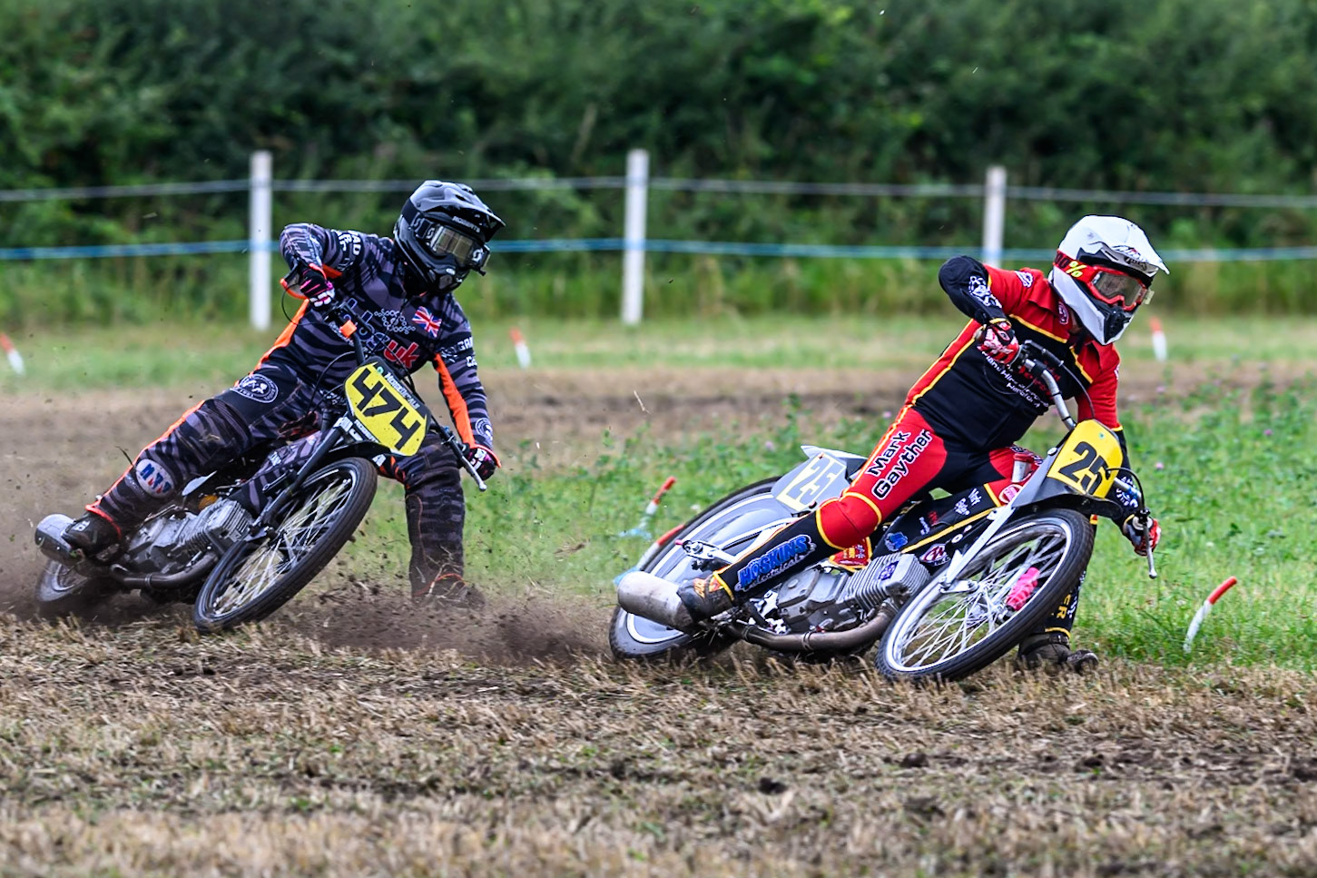 Neil Perrone (25) leading Jack Roberts (474) in the 500cc Class during the ACU Northern Grass Track Riders Championship at Cheshire Grass Track Club, Frog Lane, Knutsford, Cheshire on Sunday 20th July 2025. (Photo: Ian Charles | MI News)