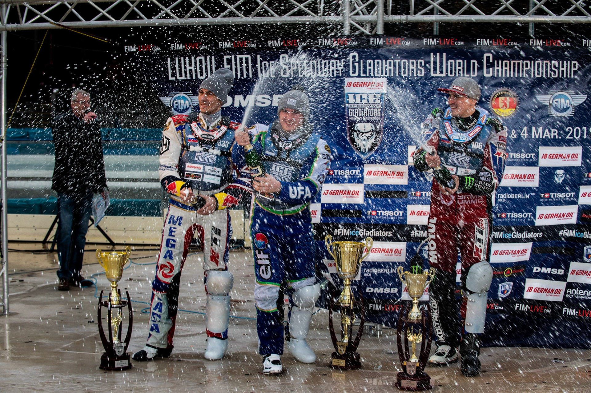 Photo: Ian Charles

Top 3 Sunday: (l-r) Danil Ivanov (333)(2nd), 114\ (Winner) Dmitri Koltakov (106) (3rd) spraying the champagne 

FIM Ice Speedway Gladiators World Championship, Final 3.2, Horst-Dohm Eisstadion, Berlin, Germany Sunday  3  March  2019
