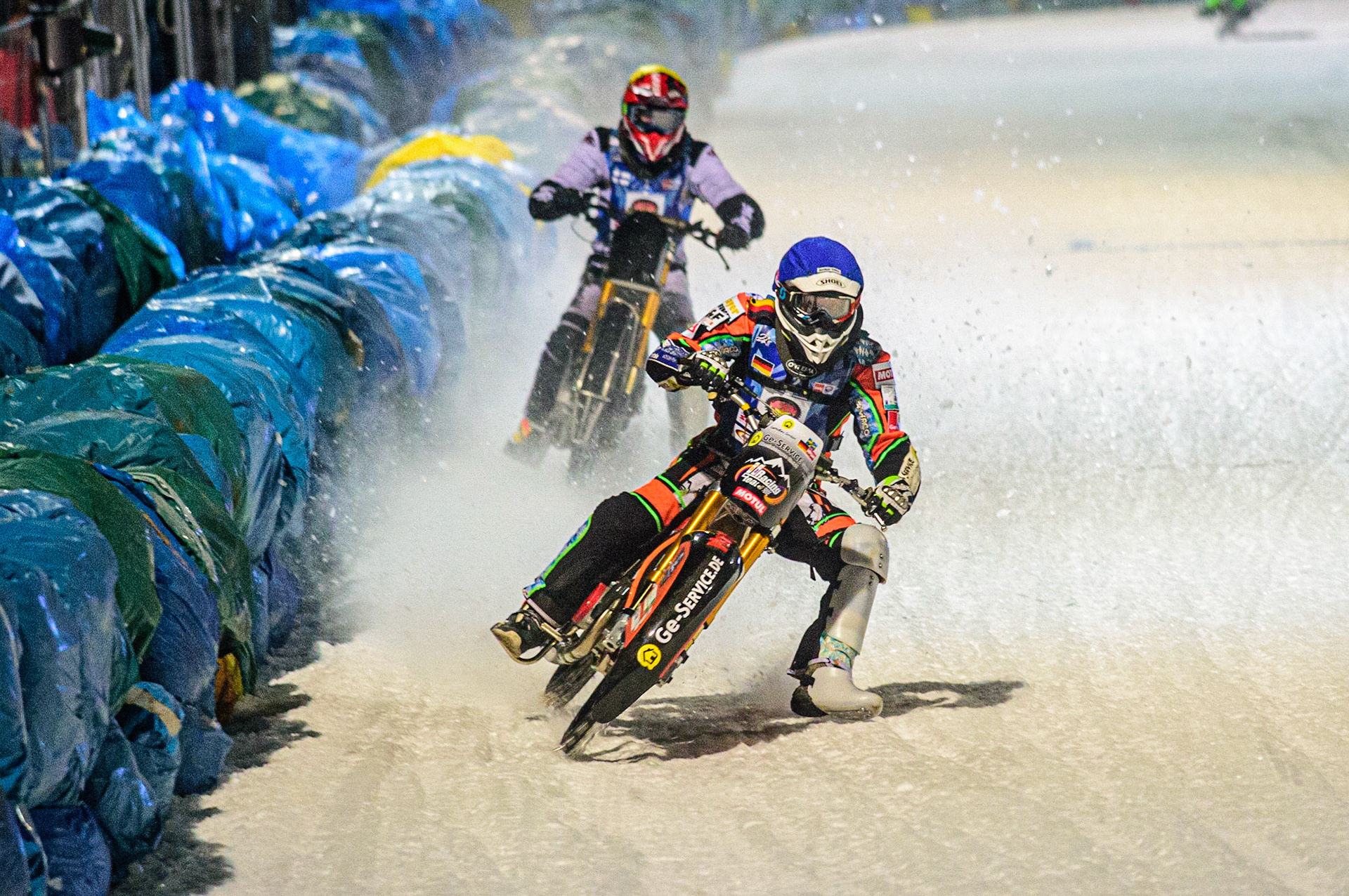 Markus Jell (Blue) leads Atte Suolami (Yellow) during the German Individual Ice Speedway Championship at Horst-Dohm-Eisstadion, Berlin on Friday 3rd March 2023. (Photo: Ian Charles | MI News)