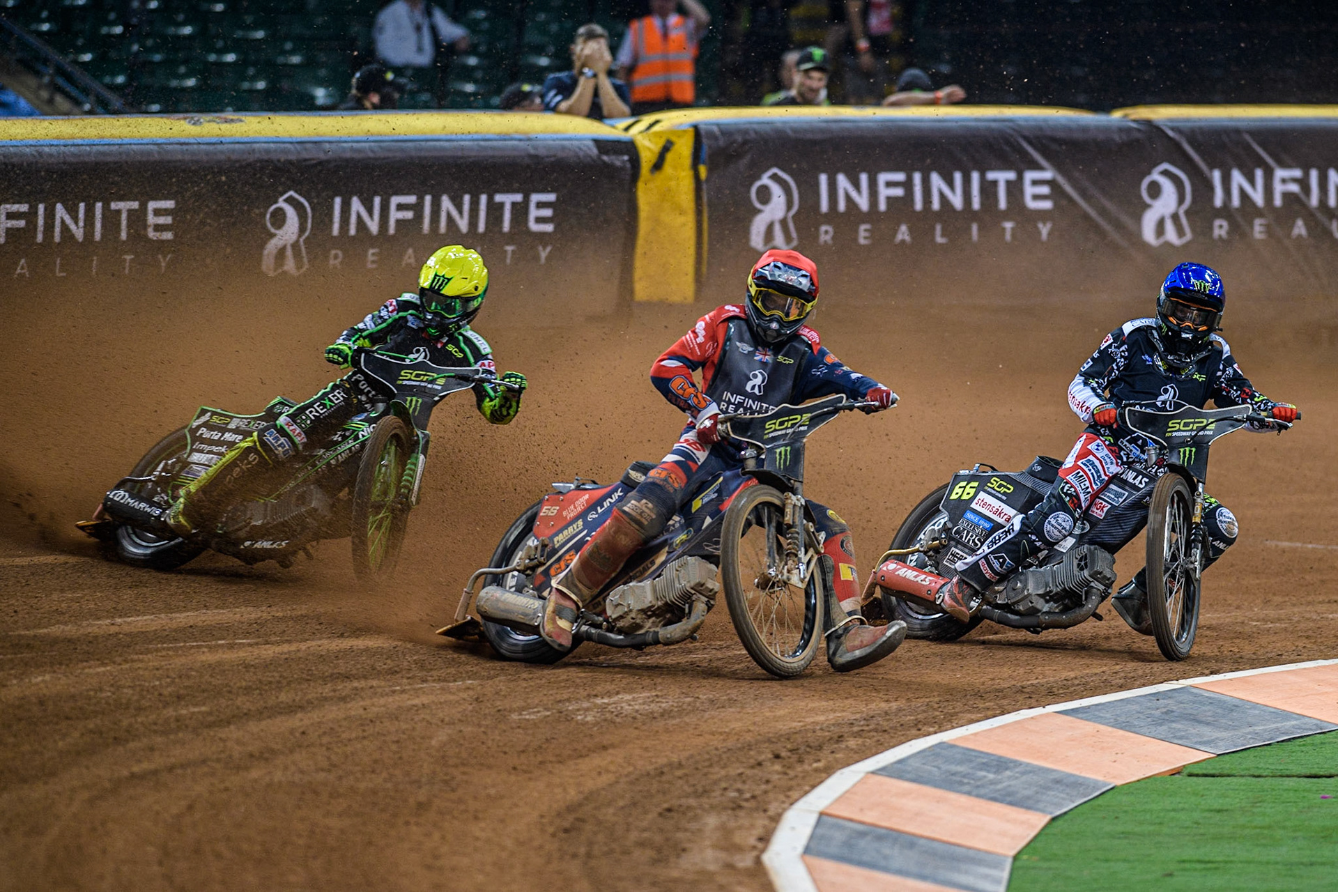 Steve Worrall (16) (Red) picks up some drive ahead of Freddie Lindgren (66) (Blue) and Patryk Dudek (692) (Yellow) during the FIM Speedway Grand Prix of Great Britain at the Principality Stadium, Cardiff on Saturday 2nd September 2023. (Photo: Ian Charles | MI News)