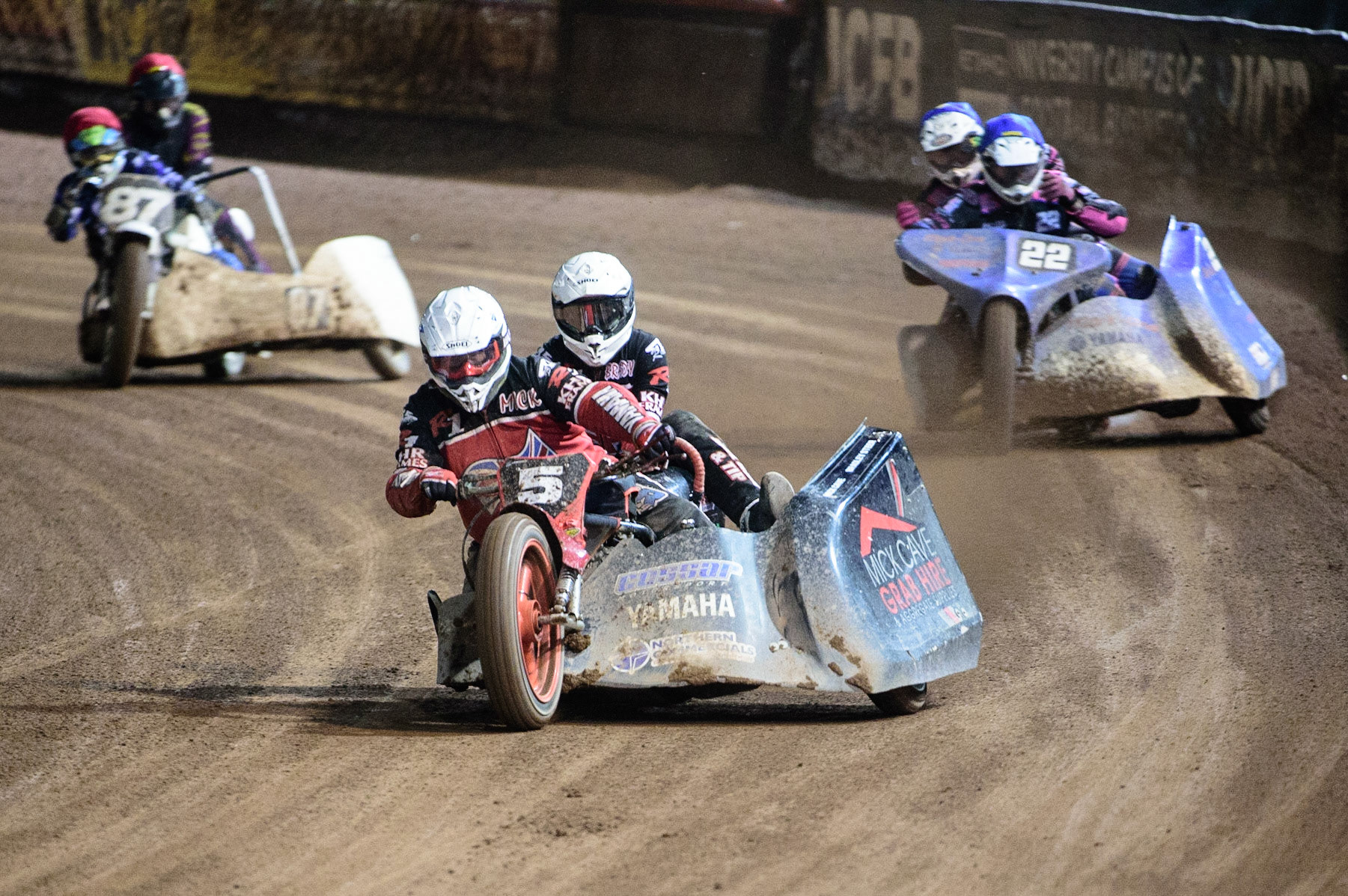 MANCHESTER, UK. OCT 30TH   Mick Cave &amp; Bradley Steer  (White) leads Will Penfold &amp; Ricky Pay  (Blue) and Rob Bradley &amp; Darren Wilce  (Red)  during the Manchester Masters Sidecar Speedway and Flat Track Racing at the National Speedway Stadium, Manchester on Saturday 30th October 2021. (Credit: Ian Charles | MI News)
