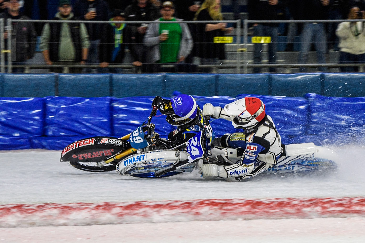 Max Koivula (24) of Finland in Red rides inside Martin Haarahiltunen (199) of Sweden in Blue  during the FIM Ice Speedway Gladiators World Championship, Final 3 at the Ice Stadium, Thialf, Heerenveen on Saturday 5th April 2025. (Photo: Ian Charles | MI News)
