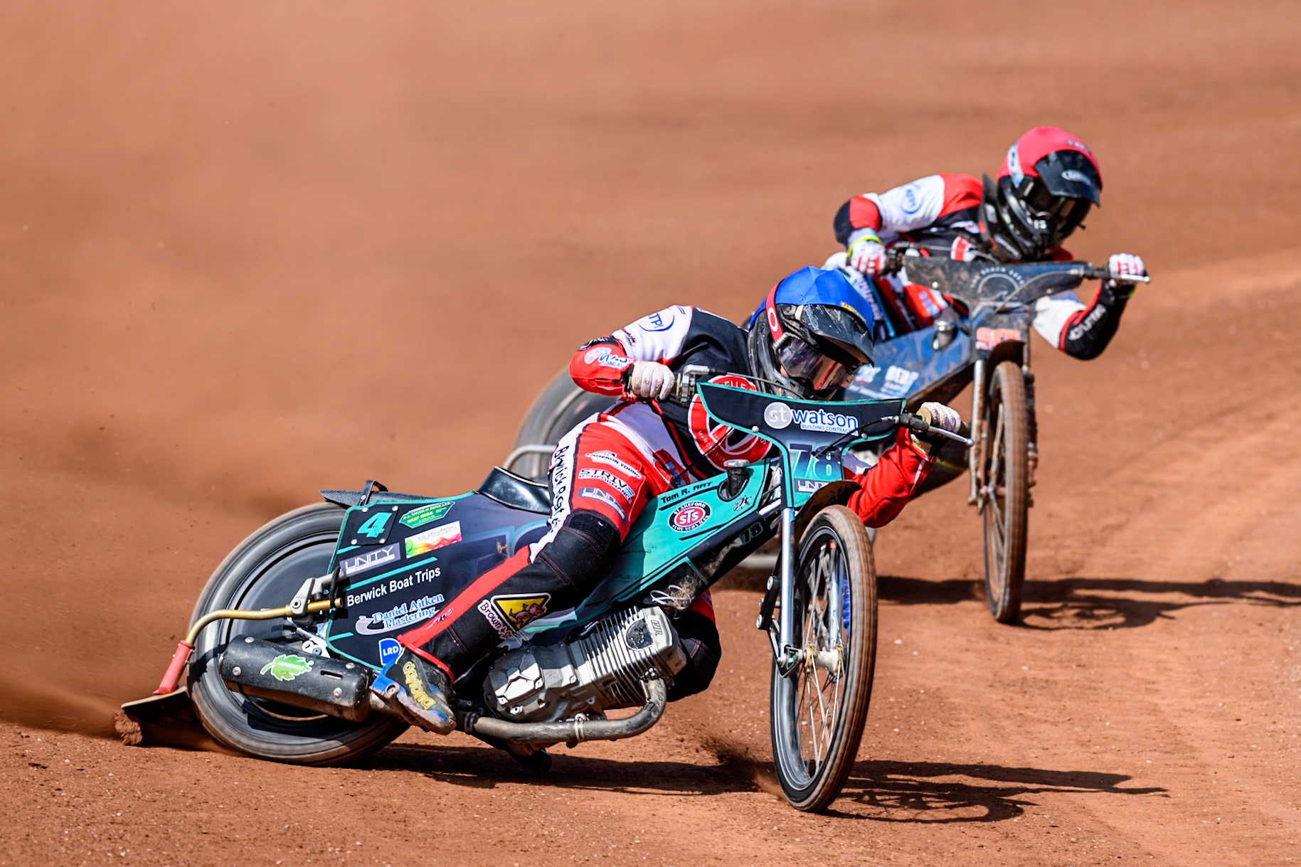 Mason Watson of Belle Vue Colts  in Blue leading Jack Kingston of Belle Vue Colts  in Red during the WSRA National Development League match between Belle Vue Colts and Middlesbrough Tigers at the National Speedway Stadium, Manchester on Sunday 10th August 2025. (Photo: Mark Fletcher | MI News)