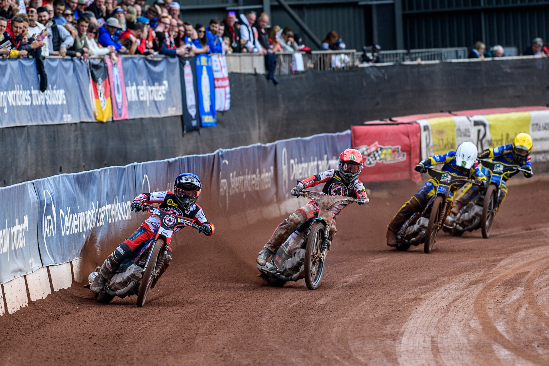 Belle Vue Aces' Ben Cook  in Blue and Belle Vue Aces' Jaimon Lidsey  in Red leading Sheffield Tigers' Jack Holder  in White and Sheffield Tigers' Kyle Howarth  in Yellow during the Rowe Motor Oil Premiership match between Belle Vue Aces and Sheffield Tigers at the National Speedway Stadium, Manchester on Monday 26th August 2024. (Photo: Ian Charles | MI News)