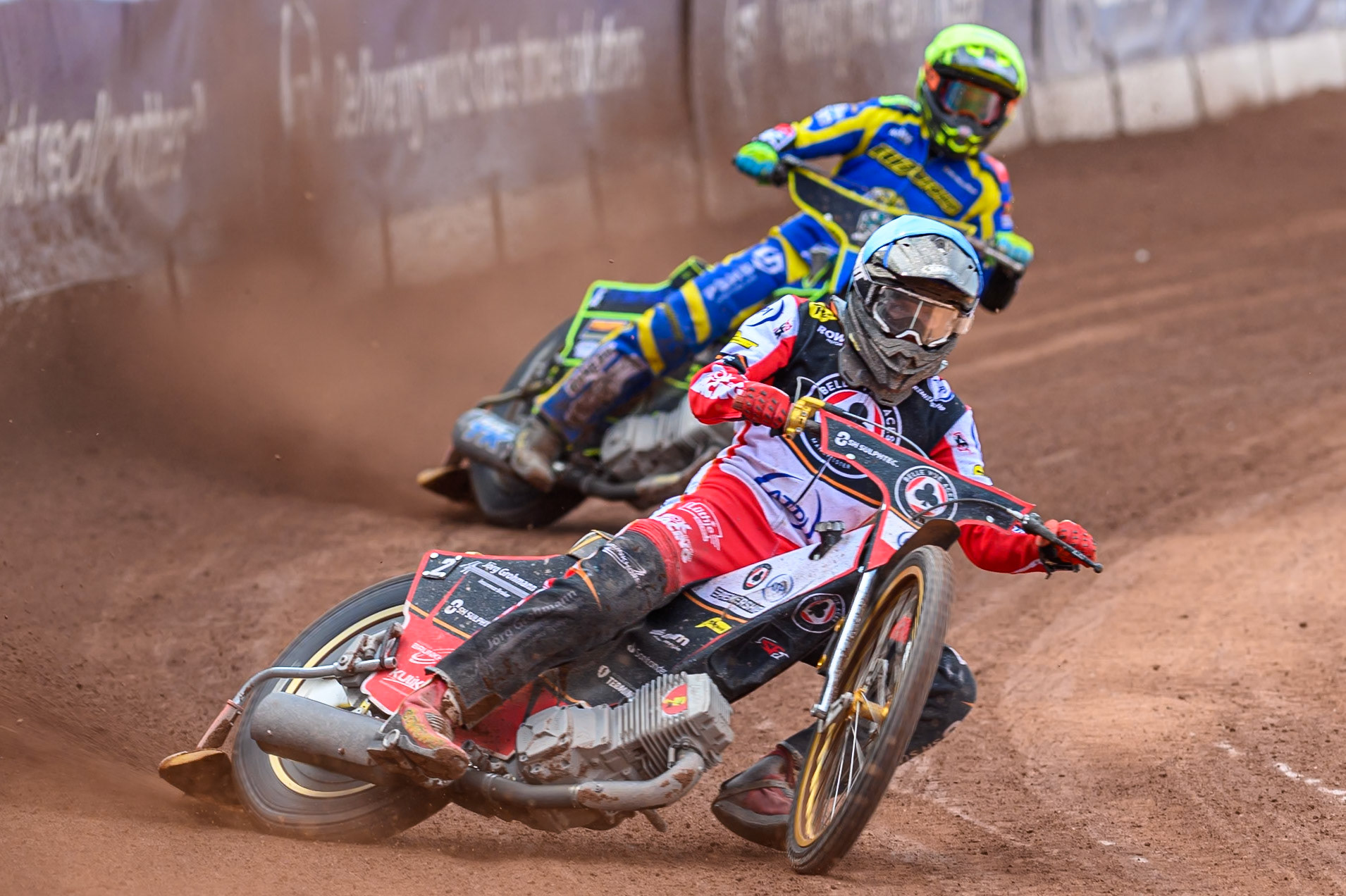 Norick Blödorn of Belle Vue Aces  in Blue leading Jye Etheridge of Sheffield Tigers   in Yellow during the Rowe Motor Oil Premiership match between Belle Vue Aces and Sheffield Tigers at the National Speedway Stadium, Manchester on Monday 25th August 2025. (Photo: Ian Charles | MI News)