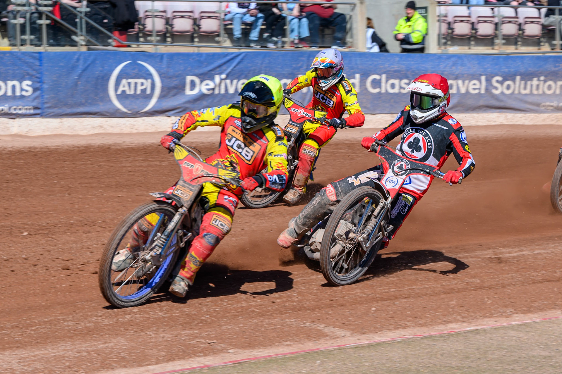 Drew Kemp of Leicester Lions  in Yellow leading Peter Kildemand of Belle Vue Aces  in Red and Nick Morris of Leicester Lions  in White during the Knockout Cup Northern Section match between Belle Vue Aces and Leicester Lions at the National Speedway Stadium, Manchester on Monday 6th April 2026. (Photo: Ian Charles | MI News)