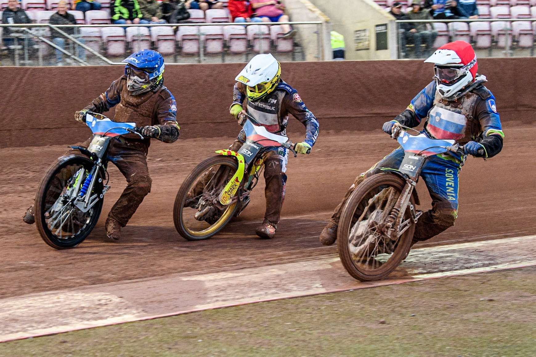 Anze Grmek of Slovenia in Red and Matic Ivacic of Slovenia in Blue try to shut out Vaclav Milik of The Czech Republic in White during the Monster Energy FIM Speedway of Nation Semi Final 2 at the National Speedway Stadium, Manchester on Wednesday 10th July 2024. (Photo: Ian Charles | MI News)