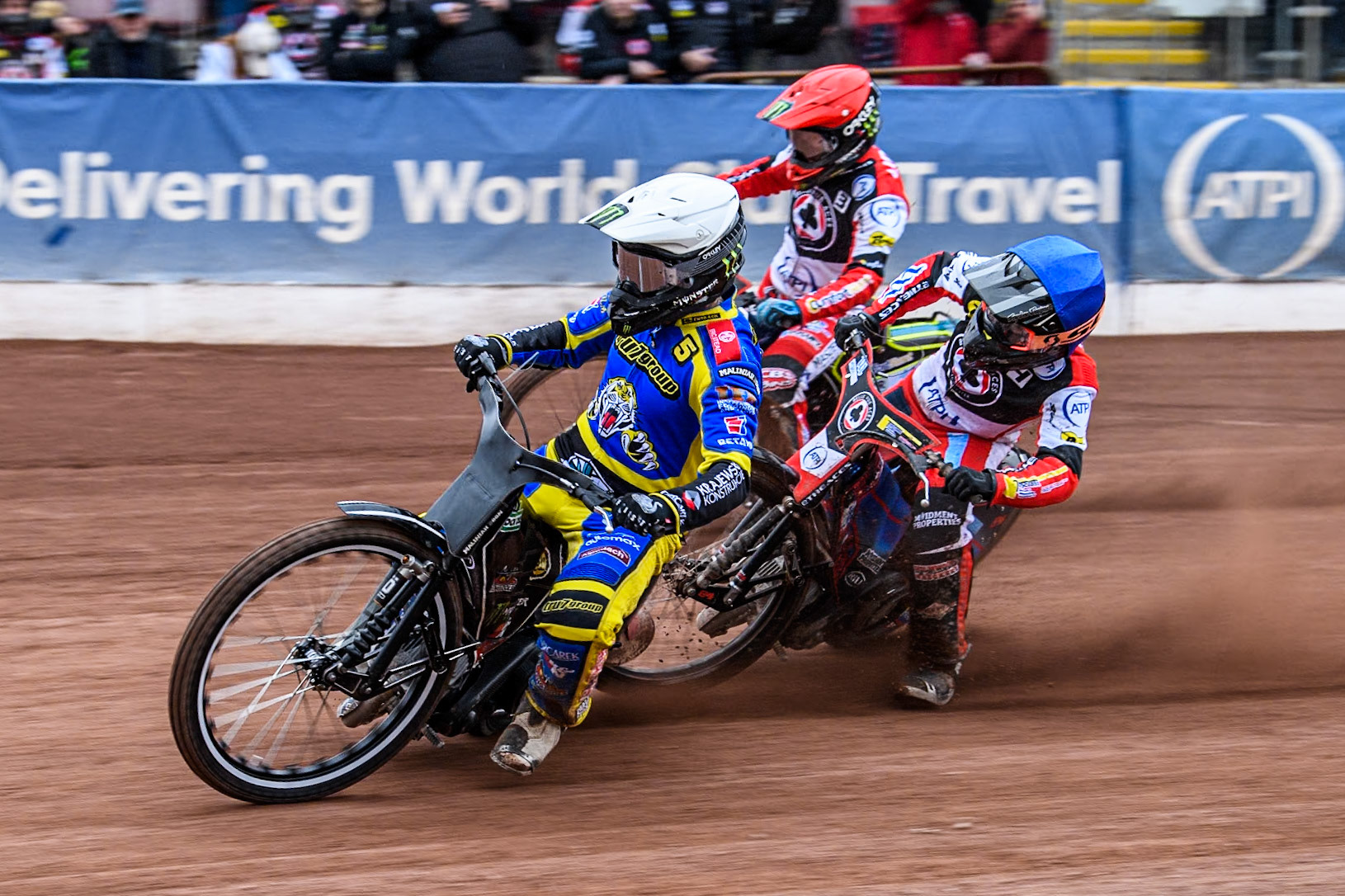 Sheffield Tigers' Tai Woffinden (White) inside Belle Vue ATPI Aces Ben Cook (Blue) and Belle Vue ATPI Aces Jaimon Lidsey (Red) during the Rowe Motor Oil Premiership KO Cup Quarter Final 1st Leg between Belle Vue Aces and Sheffield Tigers at the National Speedway Stadium, Manchester on Monday 1st April 2024. (Photo: Ian Charles | MI News)