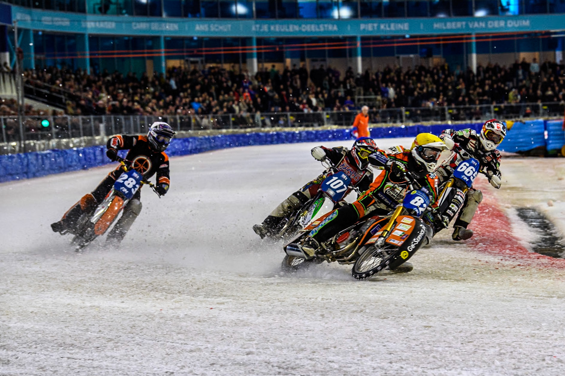 Germany's Markus Jell (82) \in Yellow leading Austria's Charly Ebner (665) in Red, Czech Republic's Andrej Diviš (107) in Blue and Netherland's Sebastian Reitsma (283) in White during the FIM Ice Speedway Gladiators World Championship Final 4 at Ice Rink Thialf, Heerenveen on Sunday 7th April 2024. (Photo: Ian Charles | MI News)