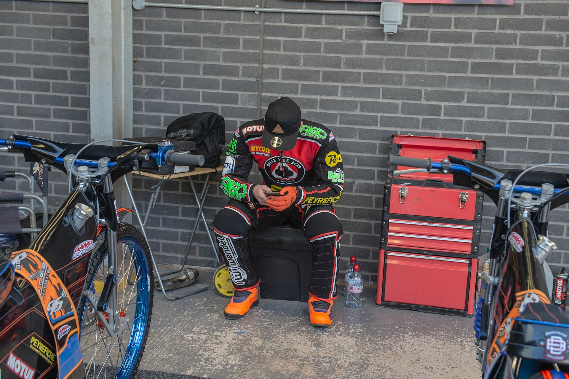 Photo by Ian Charles:

Dimitri Berge checks his phone 

Belle Vue Speedway Press & Practice Day, National Speedway Stadium, Manchester, Monday, 25, March, 2019