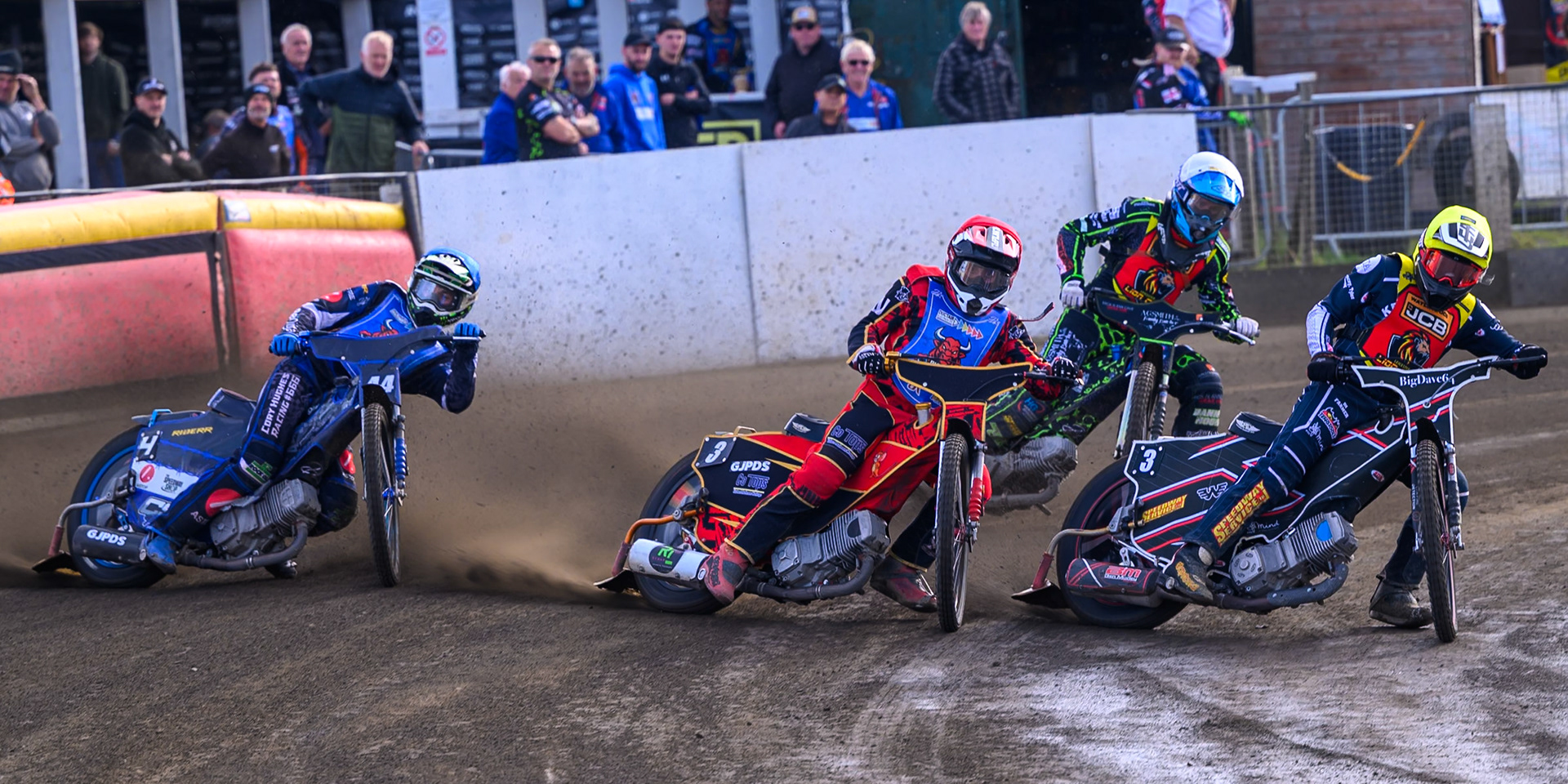 Ben Morley of Leicester Lion Cubs  in Yellow on the inside of Luke Harris of Buxton Bulls   in Red  and Charlie Southwick, Guest Rider for Buxton Bulls   in Blue  with Harrison Rogers, Guest rider for Leicester Lion Cubs in White behind during the WSRA National Development League match between Buxton Bulls and Leicester Lion Cubs at Hi-Edge Speedway, Buxton on Sunday 4th October 2026. (Photo: Ian Charles | MI News)