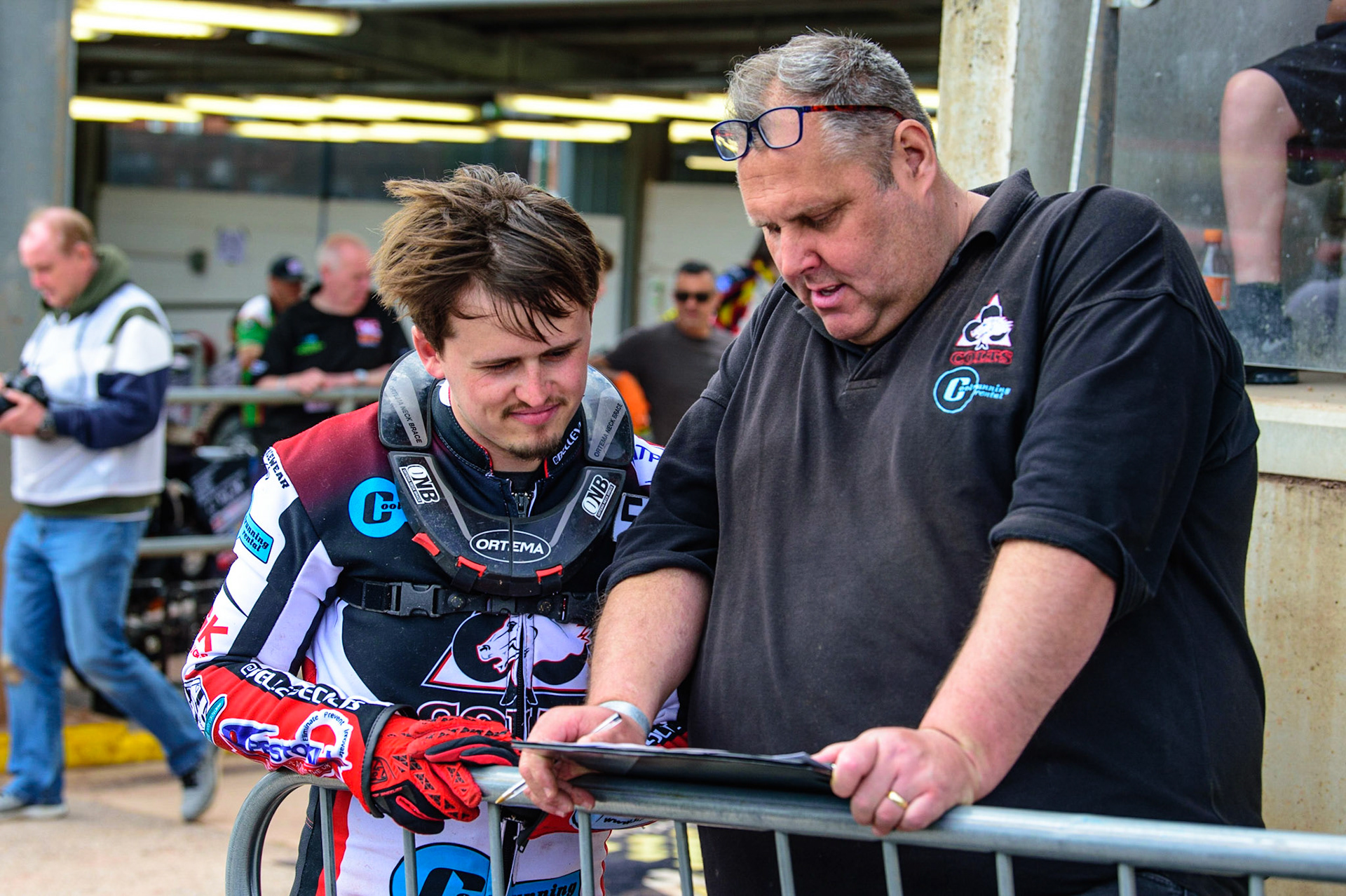 MANCHESTER, UK.  JUN 3RD  Jack Smith  (left) checks the programme with team manager Steve Williams during the National Development League match between Belle Vue Colts and Oxford Chargers at the National Speedway Stadium, Manchester on Friday 3rd June 2022. (Credit: Ian Charles | MI News)
