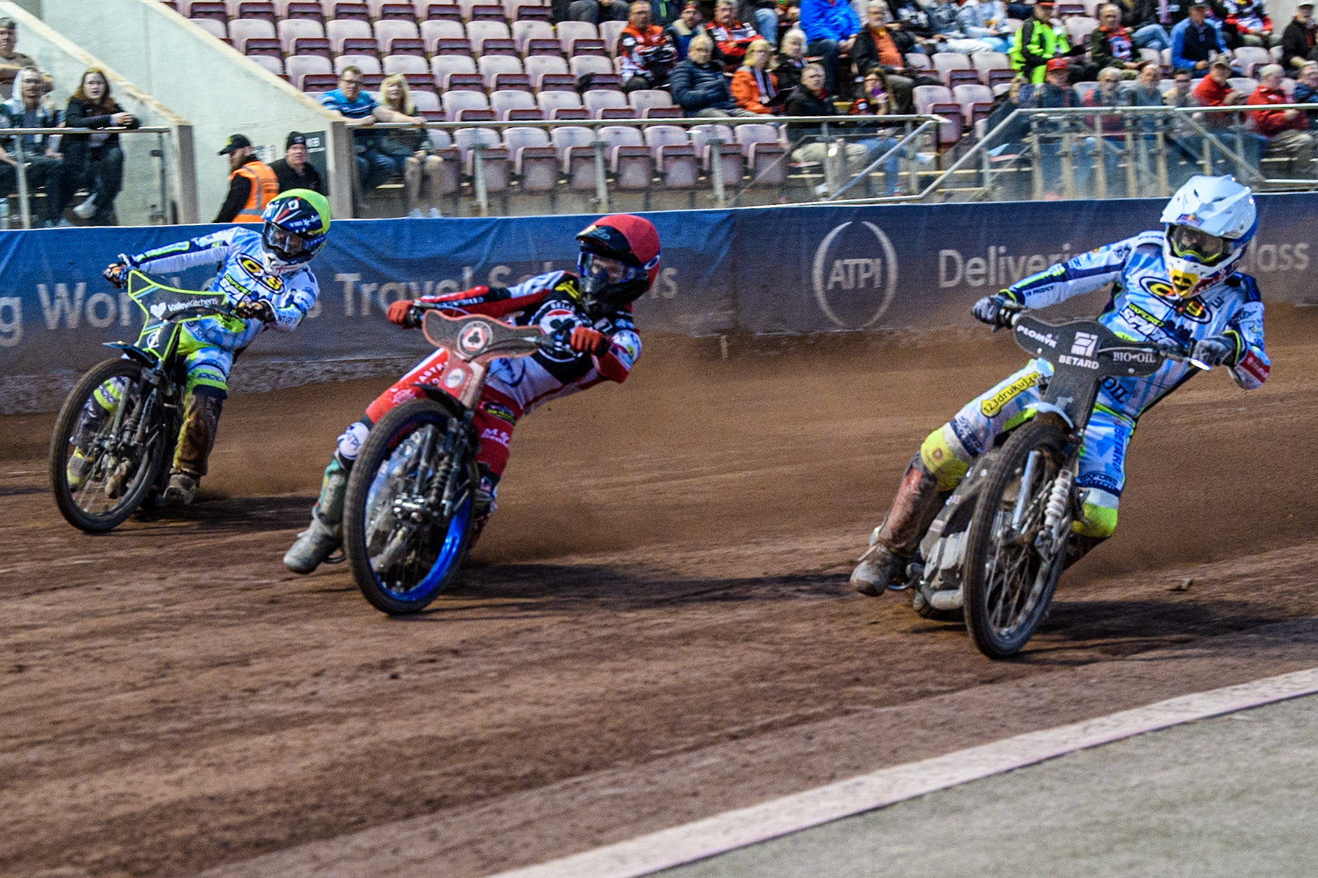 Oxford Spires' Maciej Janowski  in White rides inside Belle Vue Aces' Brady Kurtz  in Red and Oxford Spires' Rohan Tungate  in Yellow during the Rowe Motor Oil Premiership match between Belle Vue Aces and Oxford Spires at the National Speedway Stadium, Manchester on Monday 22nd July 2024. (Photo: Ian Charles | MI News)