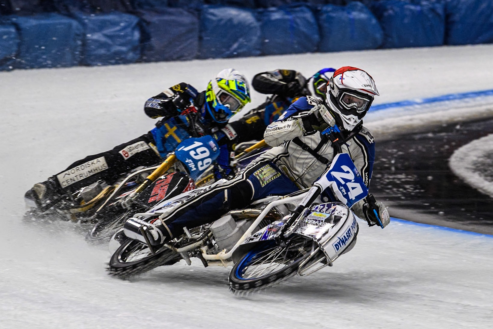 Finland's Max Koivula (24) (Red) leads  Sweden's Martin Haarahiltunen (199) (White) and Sweden"s Jimmy Olsén (81) (Blue) during the FIM Ice Speedway Gladiators World Championship Final 1 at the Max-Aicher-Arena, Inzell on Saturday 23 March 2024. (Photo: Ian Charles | MI News)