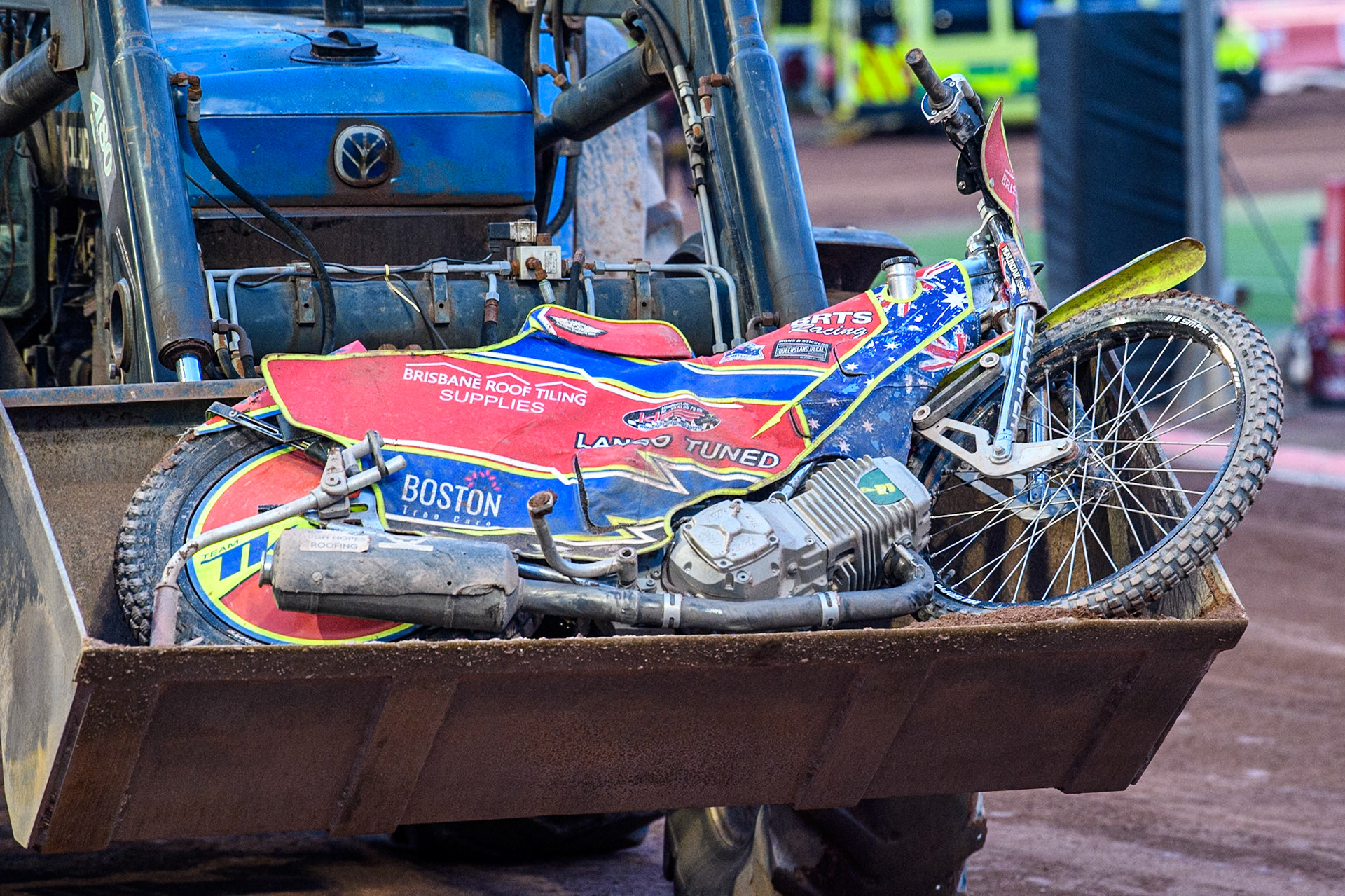 Belle Vue Aces' Tate Zischke’s bike is carried back to the pits by the tractor as it was badly damaged in the crashduring the Rowe Motor Oil Premiership match between Belle Vue Aces and Ipswich Witches at the National Speedway Stadium, Manchester on Monday 1st July 2024. (Photo: Ian Charles | MI News)