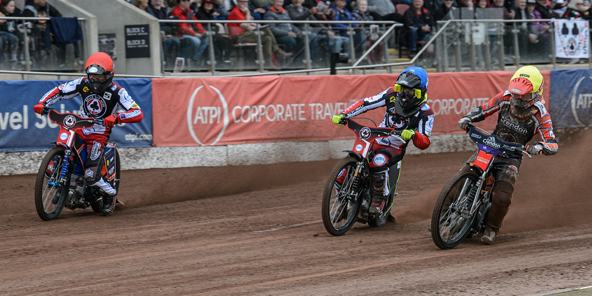 MANCHESTER, UK. MAY 2ND  Jordan Palin  (Yellow) inside Tom Brennan  (Blue) and Brady Kurtz  (Red) during the SGB Premiership match between Belle Vue Aces and Peterborough at the National Speedway Stadium, Manchester on Monday 2nd May 2022. (Credit: Ian Charles | MI News)