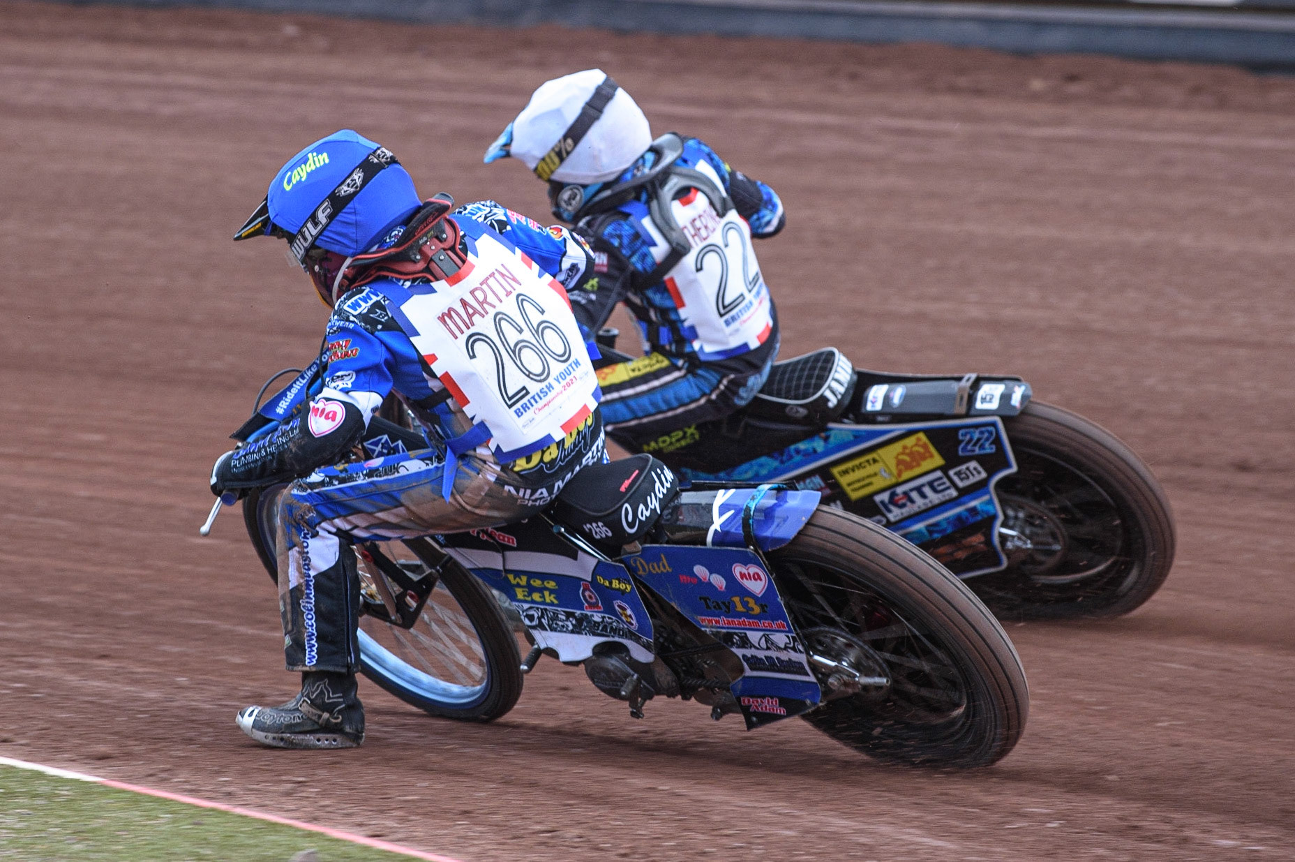 MANCHESTER, UK. AUGUST 2OTH   Caydin Martin (Blue) inside Jamie Etherington (White)at the National Speedway Stadium, Manchester on Friday 20th August 2021. (Credit: Ian Charles | MI News)