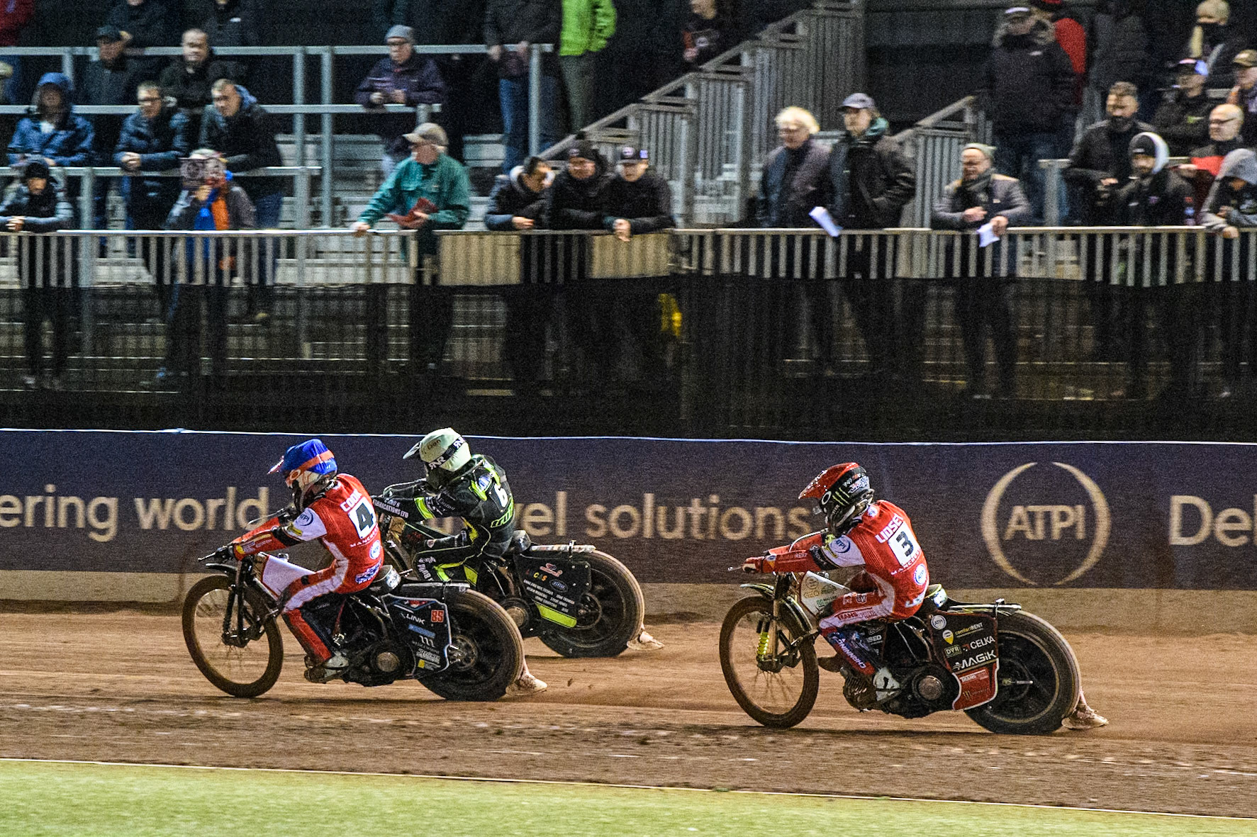Zach Cook of Belle Vue Aces in Blue rides inside Dan Thompson of Ipswich Witches in Yellow with Jaimon Lidsey of Belle Vue Aces in Red behind during the Premiership Cup Quarter Final 1st Leg match between Belle Vue Aces and Ipswich Witches at the National Speedway Stadium, Manchester on Monday 24th March 2025. (Photo: Ian Charles | MI News)