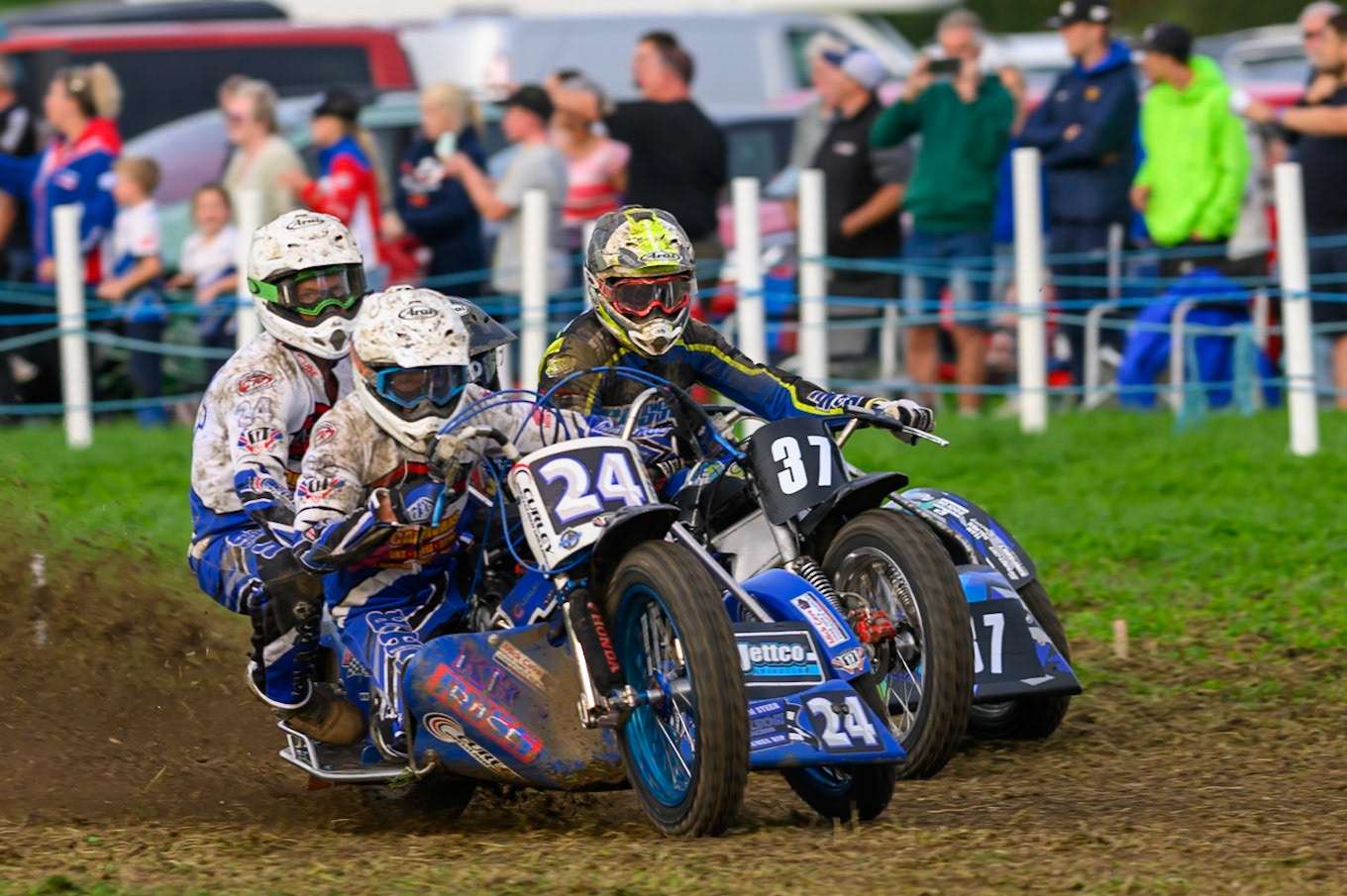 British Masters 1000cc Sidecars: Terry Saunters/Liam Brown (24) leading Mark Cossar/Wayne Rickards (37)  in the final before the race was stopped on the first lap due to a crash during the British Masters Grasstrack Championship at Lower Marsh Farm, Much Hoole, Preston in Lancashire, England on Sunday 13th September 2026. (Photo: Ian Charles | MI News)