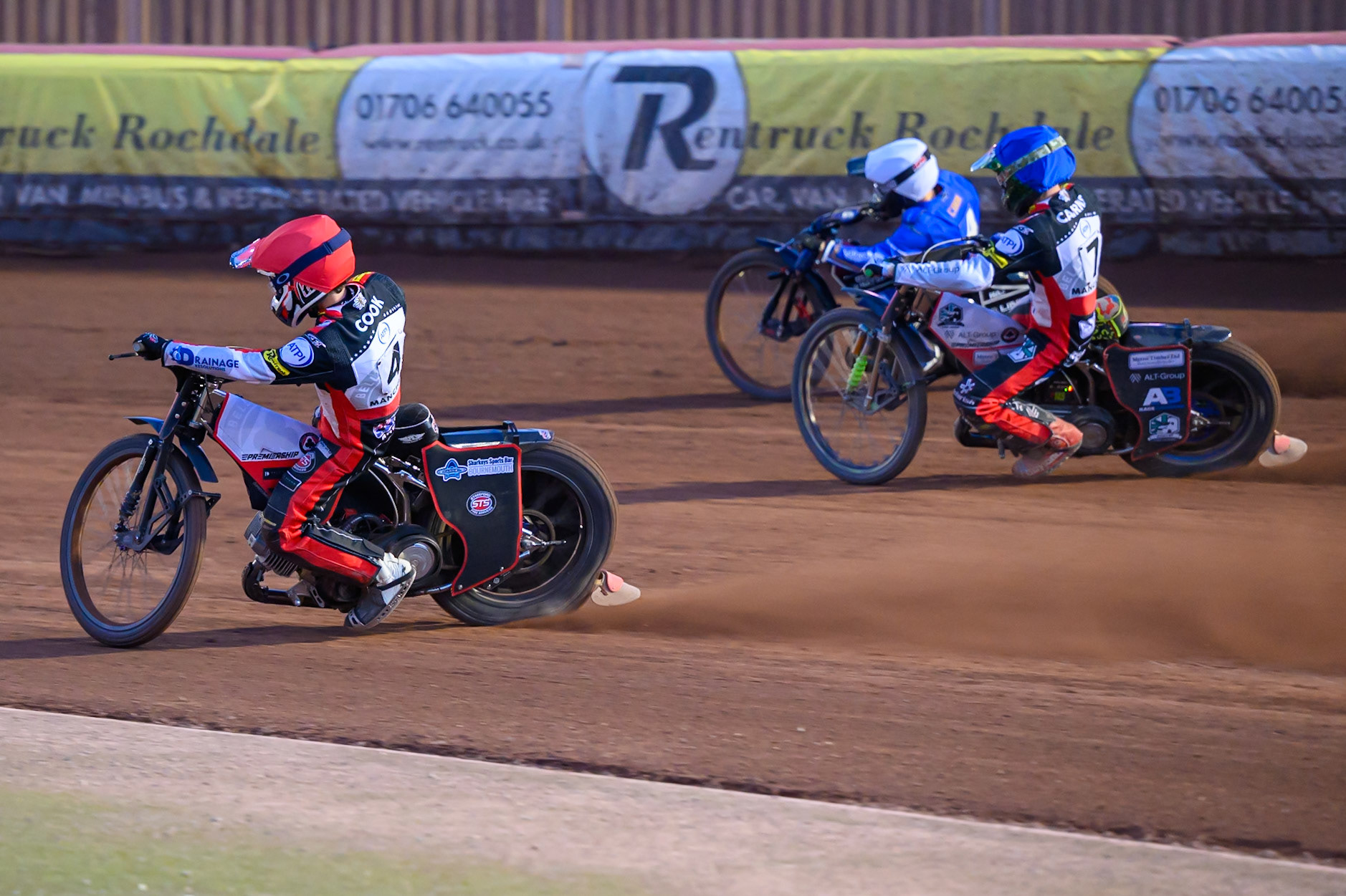 Zach Cook of Belle Vue Aces in Red rides inside William Cairns of Belle Vue Aces in Blue  and Ben Cook of Kings Lynn Stars in White  during the Rowe Motor Oil Premiership match between Belle Vue Aces and King's Lynn Stars at the National Speedway Stadium, Manchester on Monday 10th August 2026. (Photo: Ian Charles | MI News)