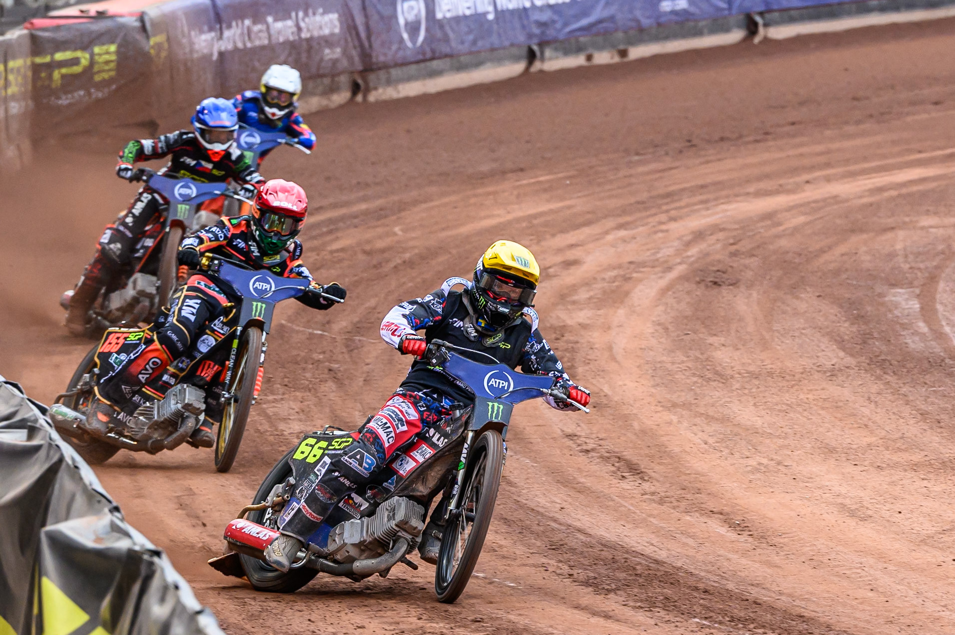 Fredrik Lindgren (66) of Sweden in Yellow leading Mikkel Michelsen (155) of Denmark in Red, January Kvech (201) of Czech Republic in Blue and Andzejs Lebedevs (29) of Latvia in White during the ATPI FIM Speedway Grand Prix Round 4 at the National Speedway Stadium, Manchester, on Friday 13th June 2025. (Photo: Ian Charles | MI News)