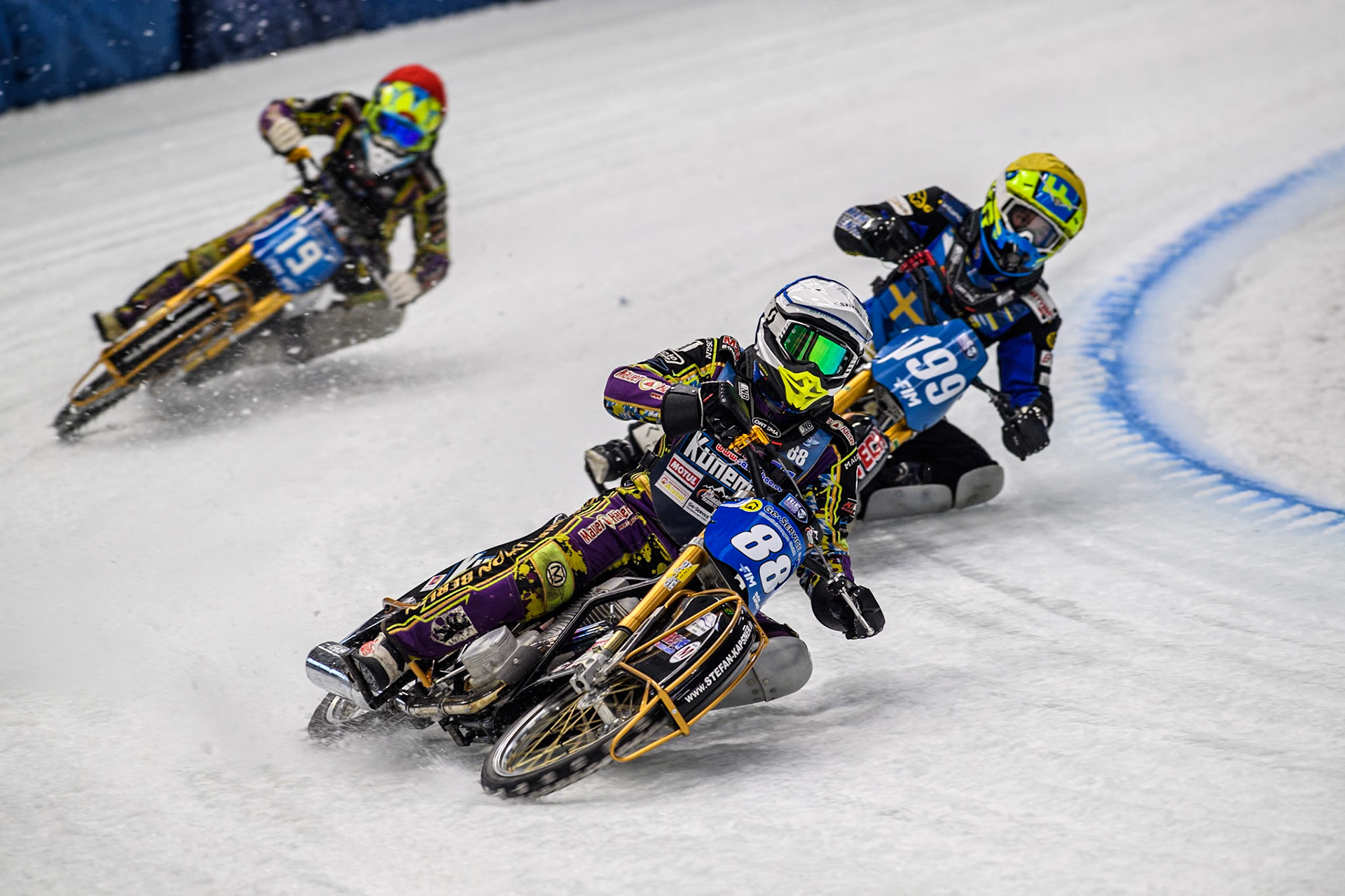 Germany's Max Niedermaier (88) (Blue) leads  Sweden's Martin Haarahiltunen (199)  (Yellow) and German Reserve Maximillian Neidermaier (19) (Red) during the FIM Ice Speedway Gladiators World Championship Final 2 at the Max-Aicher-Arena, Inzell on Sunday 24 March 2024. (Photo: Ian Charles | MI News)