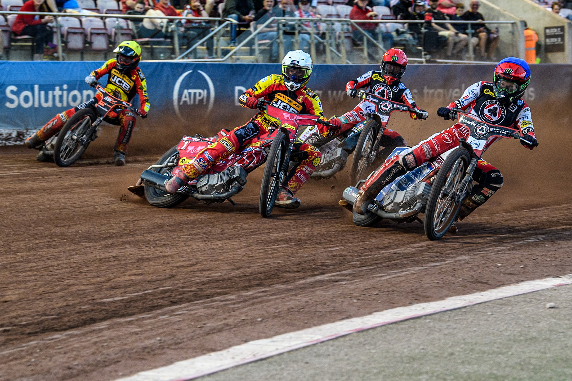 Belle Vue Aces' Dan Bewley in Blue rides inside Leicester Lions' Max Fricke in White with Belle Vue Aces' Jaimon Lidsey in Red and Leicester Lions' Sam Masters in Yellow behind during the Rowe Motor Oil Premiership match between Belle Vue Aces and Leicester Lions at the National Speedway Stadium, Manchester on Monday 24th June 2024. (Photo: Ian Charles | MI News)