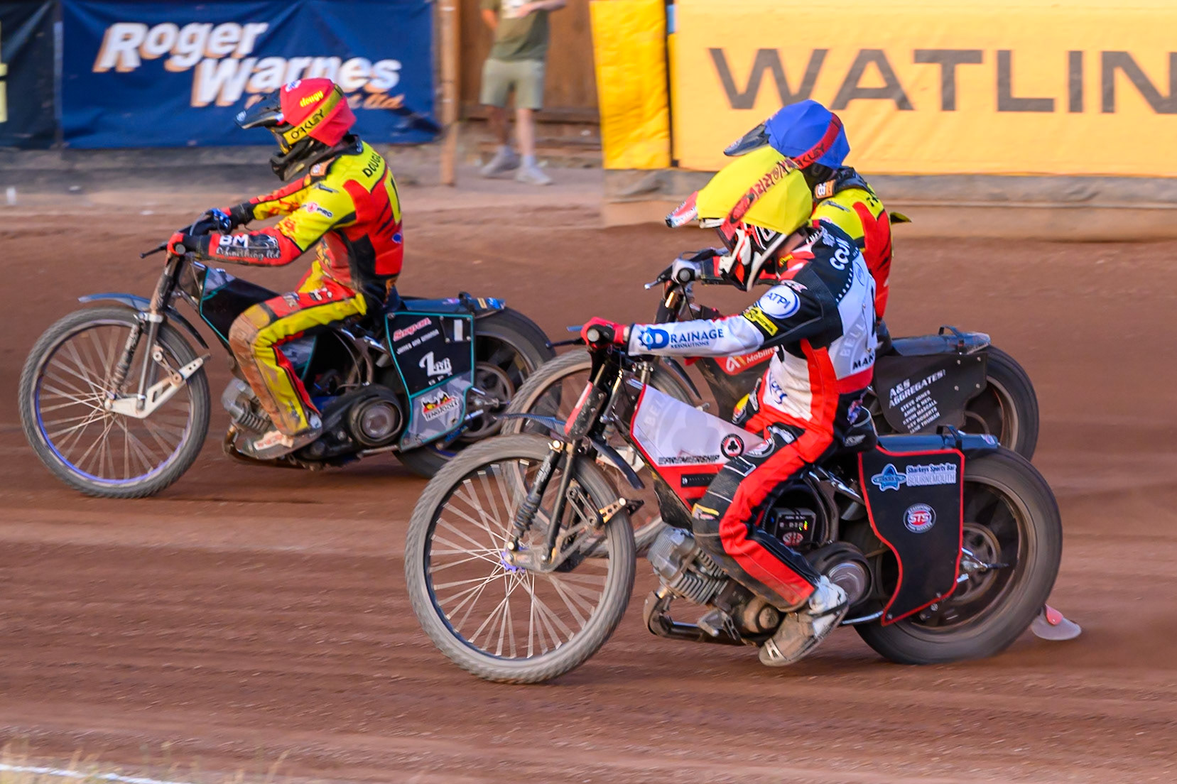 Zach Cook of Belle Vue Aces  in Yellow on the inside of Dan Thompson of Leicester Lions  in Blue and Ryan Douglas of Leicester Lions in Red  during the Rowe Motor Oil Premiership match between Leicester Lions and Belle Vue Aces at the Hydroscan Arena, Leicester on Thursday 23rd July 2026. (Photo: Ian Charles | MI News)