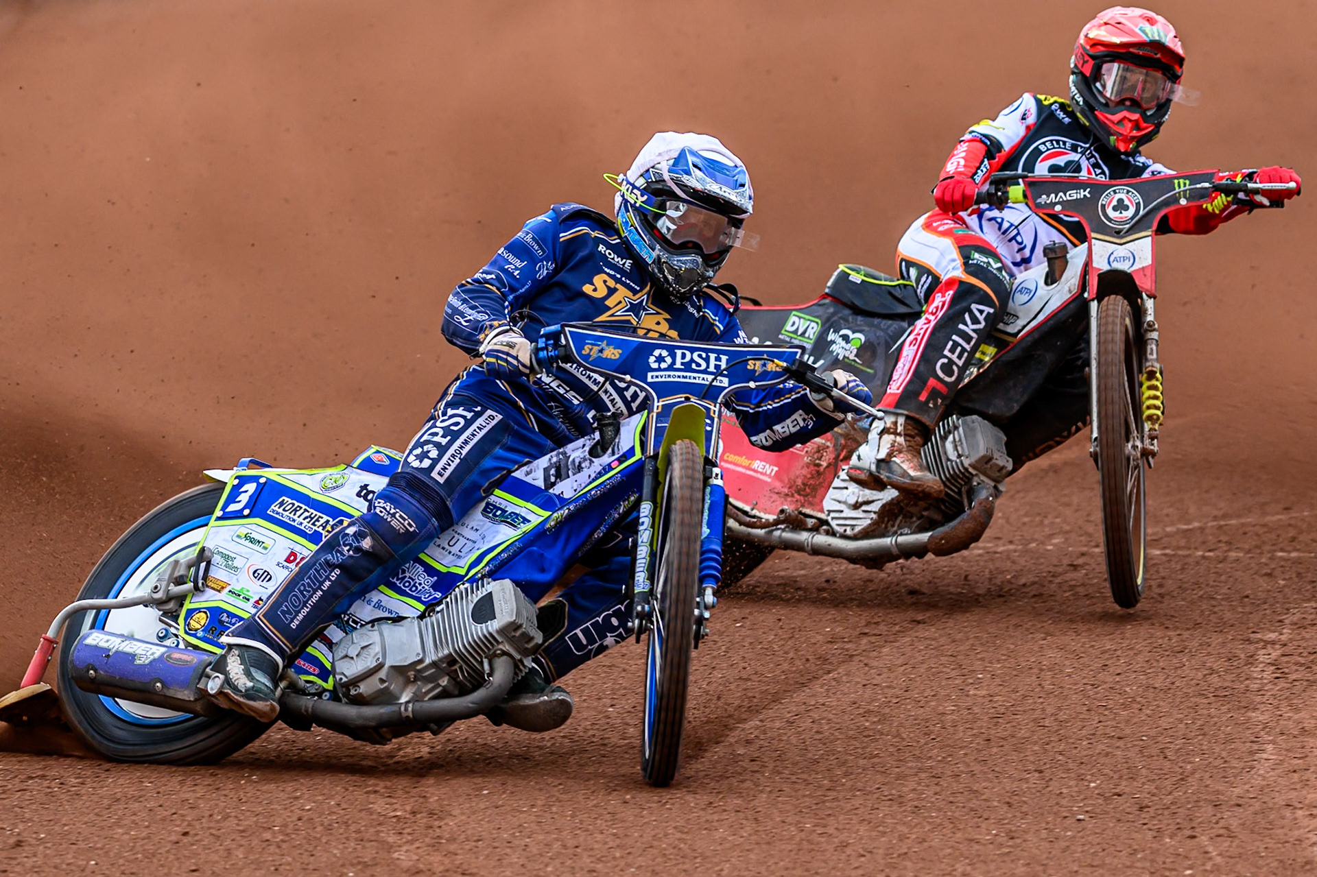 Kings Lynn Stars' Chris Harris in White leading Belle Vue Aces' Jaimon Lidsey in Red during the Rowe Motor Oil Premiership match between Belle Vue Aces and King's Lynn Stars at the National Speedway Stadium, Manchester on Monday 23rd June 2025. (Photo: Ian Charles | MI News)