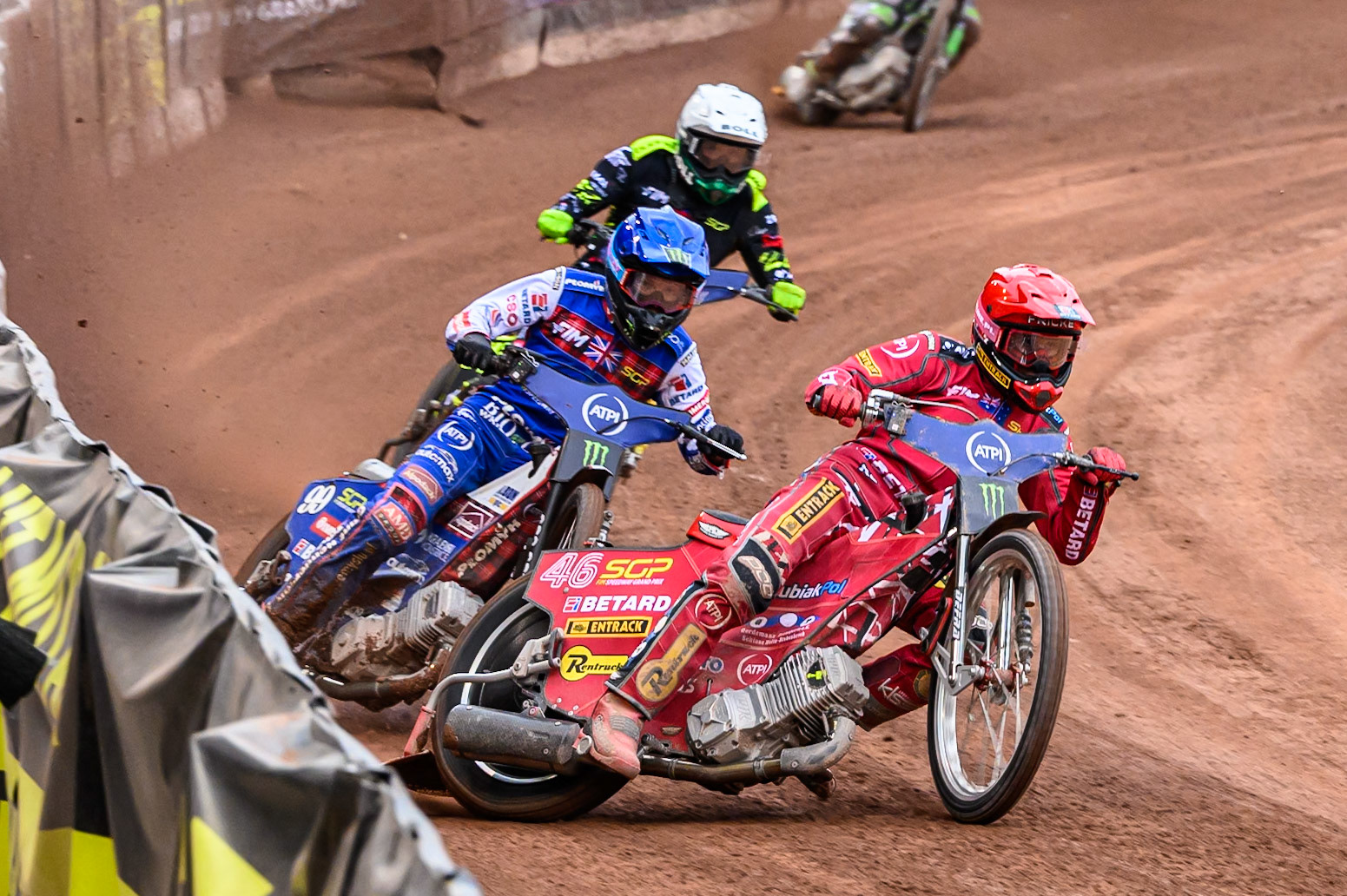 Max Fricke (46) of Australia in Red leading Dan Bewley (99) of Great Britain in Blue and Martin Vaculik (54) of Slovakia in White during the ATPI FIM Speedway Grand Prix Round 4 at the National Speedway Stadium, Manchester, on Friday 13th June 2025. (Photo: Ian Charles | MI News)