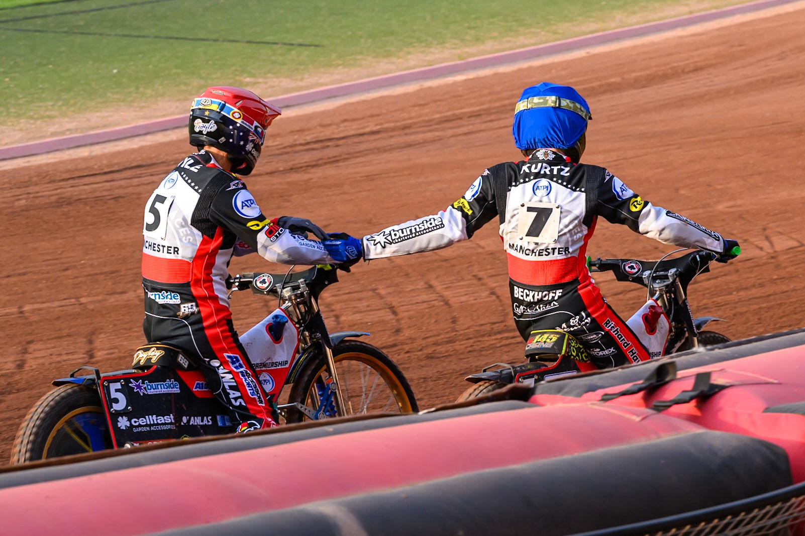 Jason Doyle of Belle Vue Aces in Red and William Cairns of Belle Vue Aces in Blue  celebrate their maximum heat win in heat 4 during the Rowe Motor Oil Premiership match between Belle Vue Aces and Leicester Lions at the National Speedway Stadium, Manchester on Monday 3rd August 2026. (Photo: Ian Charles | MI News)