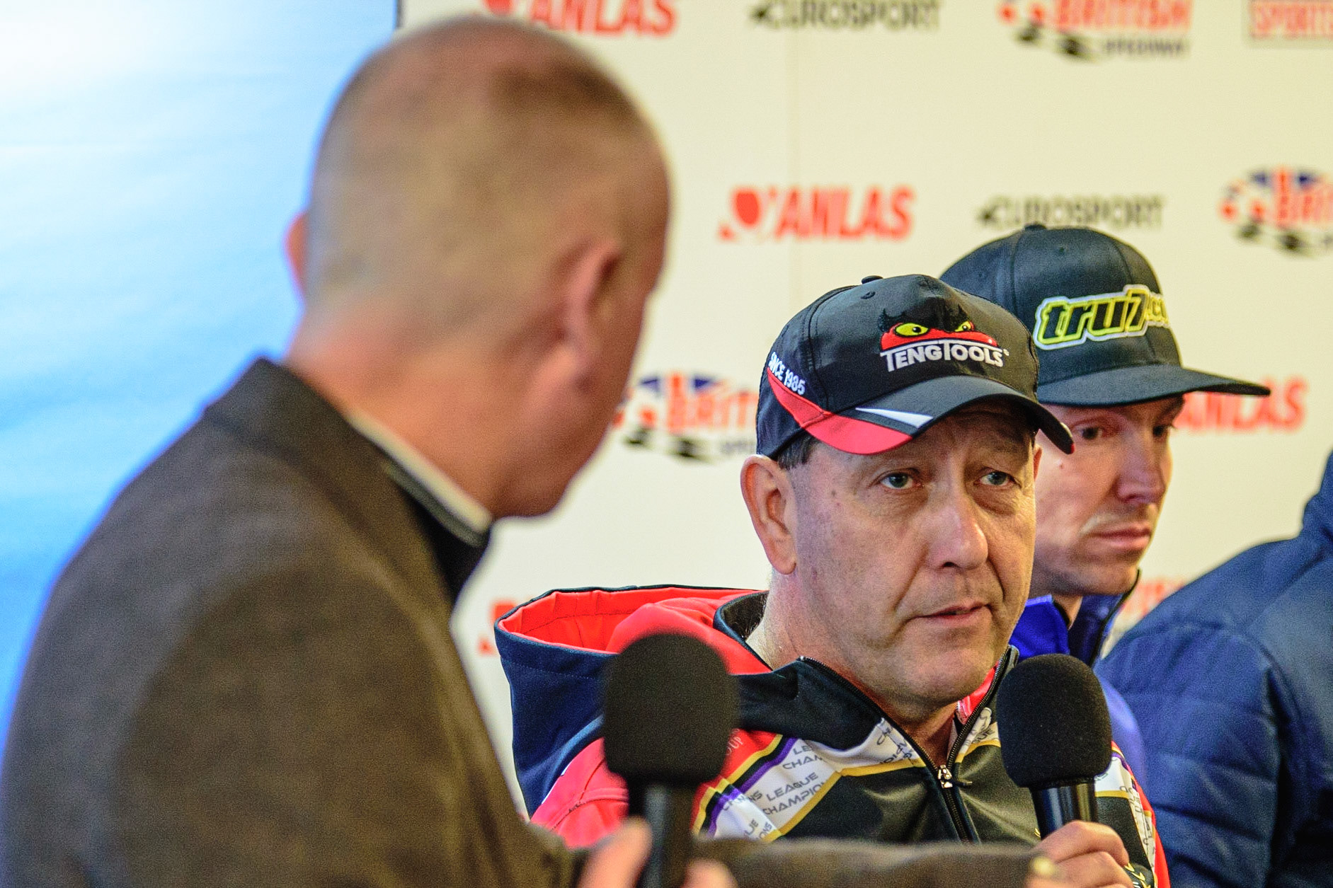 MANCHESTER, UK. APRIL 12TH: Rob Lyons (right) is asked a question by Nigel Pearson at the Discovery Networks Eurosport Speedway Season Launch at the National Speedway Stadium, Manchester on Tuesday 12th April 2022 (Credit: Ian Charles | MI News)