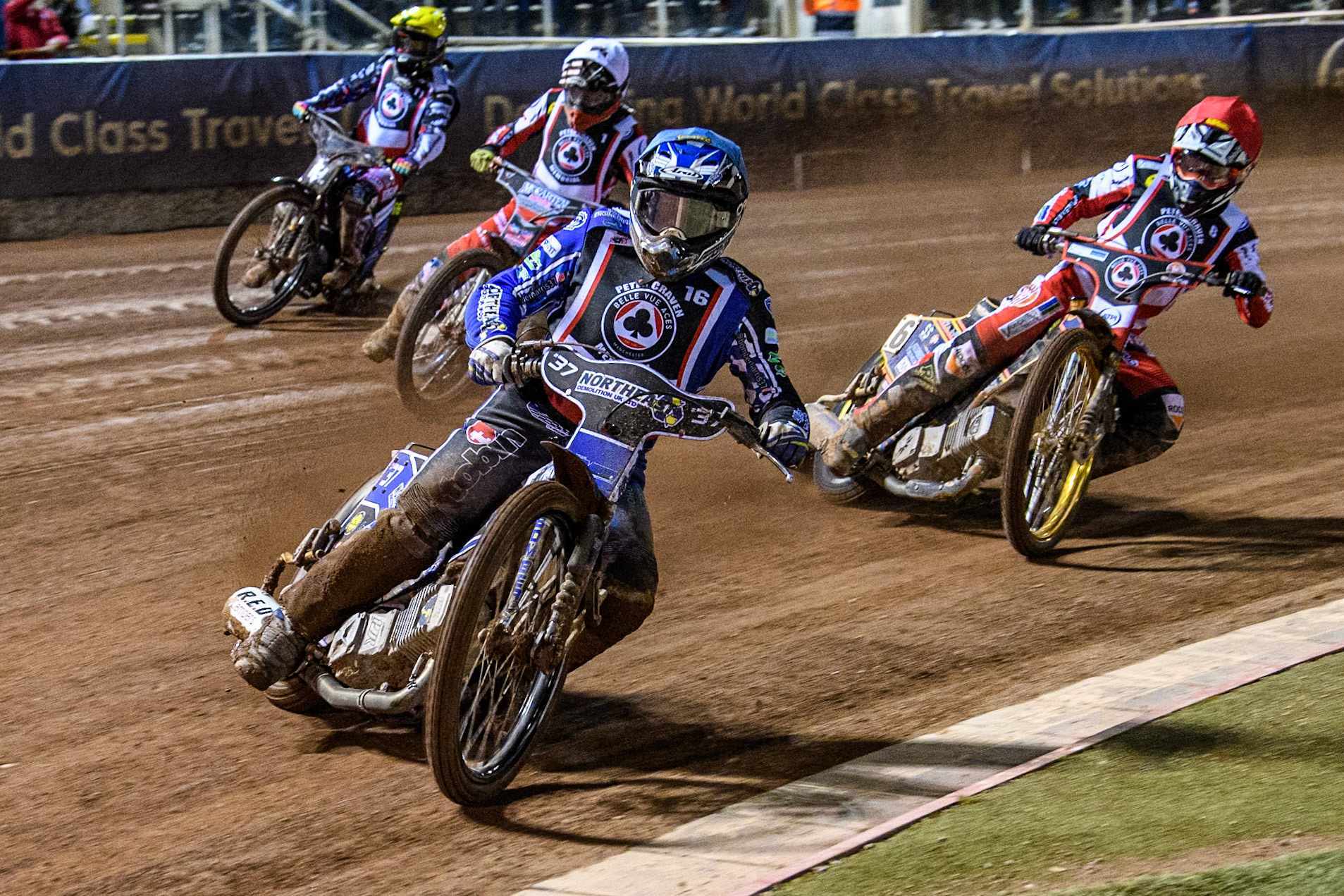 England's Chris Harris (Blue) leads  England's Connor Mountain (Red), England's Connor Bailey (White) and Sweden’s Fredrik Lindgren (Yellow) during the Peter Craven Memorial Trophy meeting at the National Speedway Stadium, Manchester on Monday 18th March 2024. (Photo: Ian Charles | MI News)
