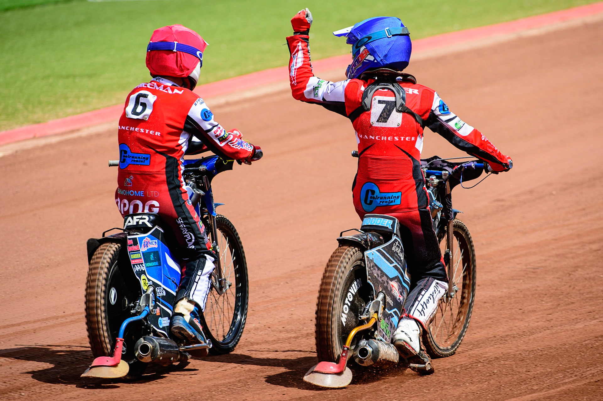 MANCHESTER, UK.  JUN 3RD  Archie Freeman  (Red) and Freddy Hodder  (Blue) celebrate their heat win during the National Development League match between Belle Vue Colts and Oxford Chargers at the National Speedway Stadium, Manchester on Friday 3rd June 2022. (Credit: Ian Charles | MI News)