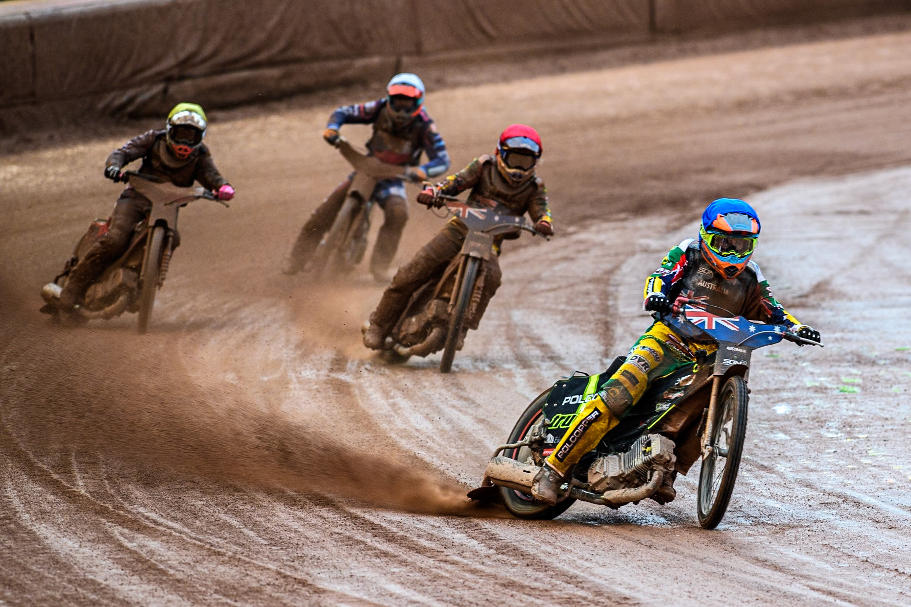 Keynan Rew of Australia in Blue leading James Pearson of Australia in Red Matous Kamenik of Czech Republic in White and Jan Jenicek of Czech Republic in Yellow during the Monster Energy FIM Speedway of Nations 2 (Under 21) Final at the National Speedway Stadium, Manchester on Friday 12th July 2024. (Photo: Ian Charles | MI News)