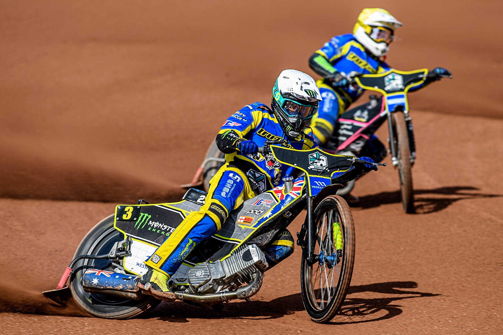 Sheffield Tigers' Chris Holder in White leading Sheffield Tigers' Josh Pickering  in Yellow during the Rowe Motor Oil Premiership match between Belle Vue Aces and Sheffield Tigers at the National Speedway Stadium, Manchester on Monday 26th August 2024. (Photo: Ian Charles | MI News)
