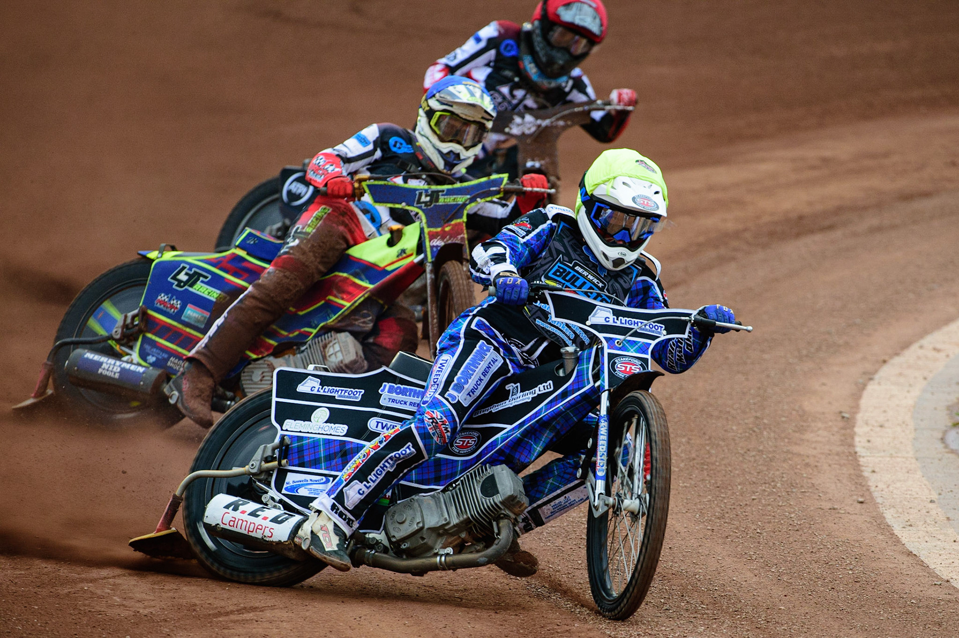 MANCHESTER, UK. JUN 24TH  Greg Blair  (Yellow) leads Harry McGurk  (Red) and Nathan Ablitt  (Blue) during the National Development League match between Belle Vue Colts and Berwick Bullets at the National Speedway Stadium, Manchester on Friday 24th June 2022. (Credit: Ian Charles | MI News)