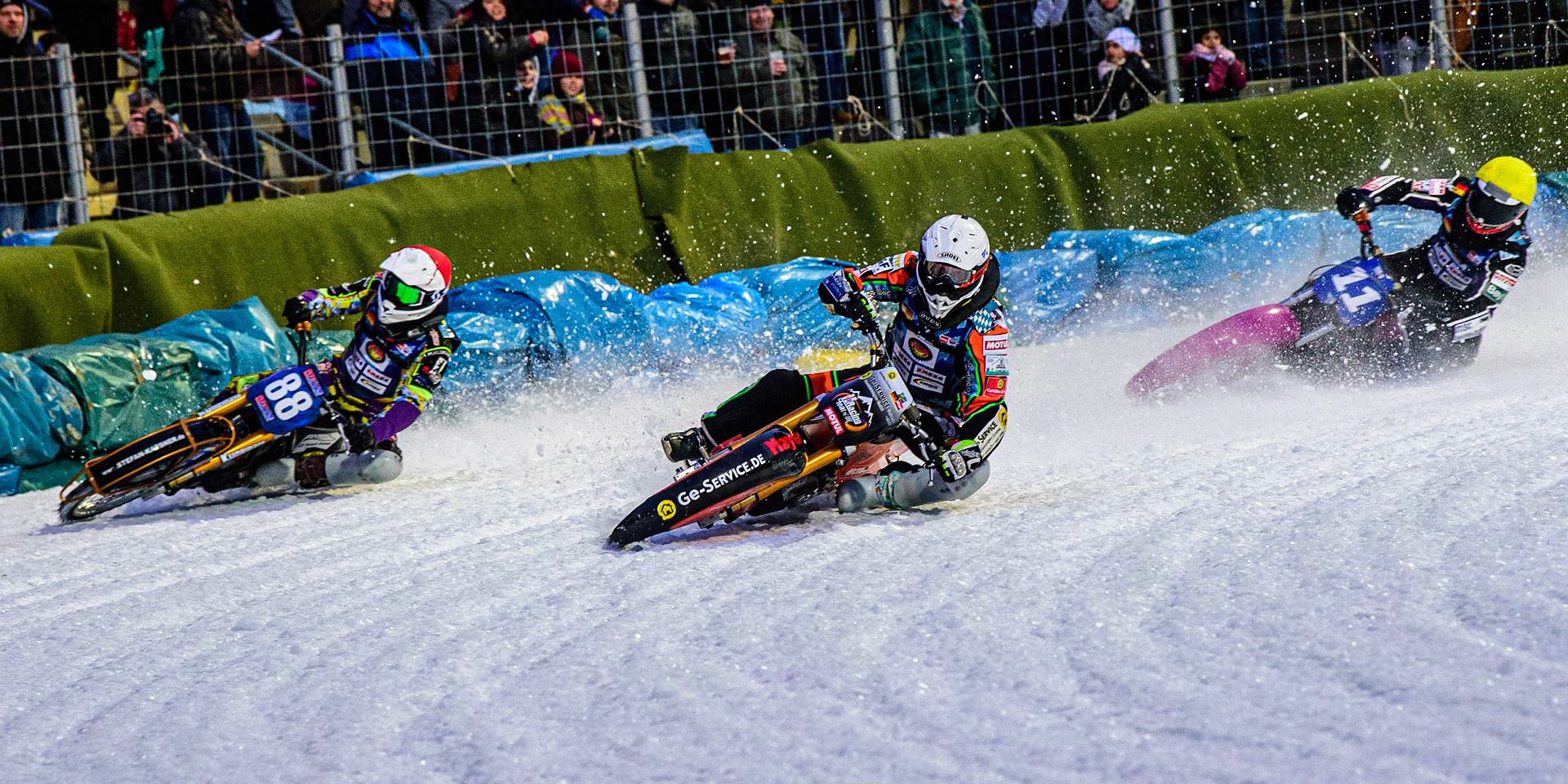 Markus Jell (White) leads Max Neidermaier (Red) and Benedikt Monn (Yellow) during the German Individual Ice Speedway Championship at Horst-Dohm-Eisstadion, Berlin on Friday 3rd March 2023. (Photo: Ian Charles | MI News)