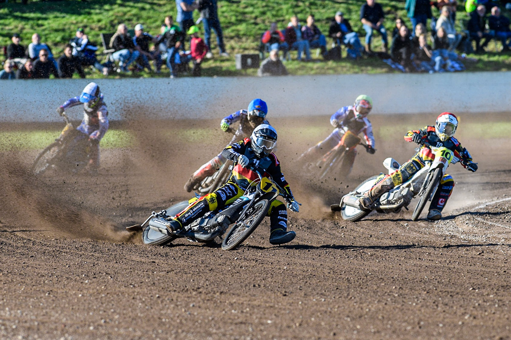 Erik Riss (White) and  Martin Smolinski (Red) lead the pack inn Heat 6 as Germany beat France during the FIM Long Track Of Nations event at the Speed Centre Roden on Sunday 24th September 2023. (Photo: Ian Charles | MI News)