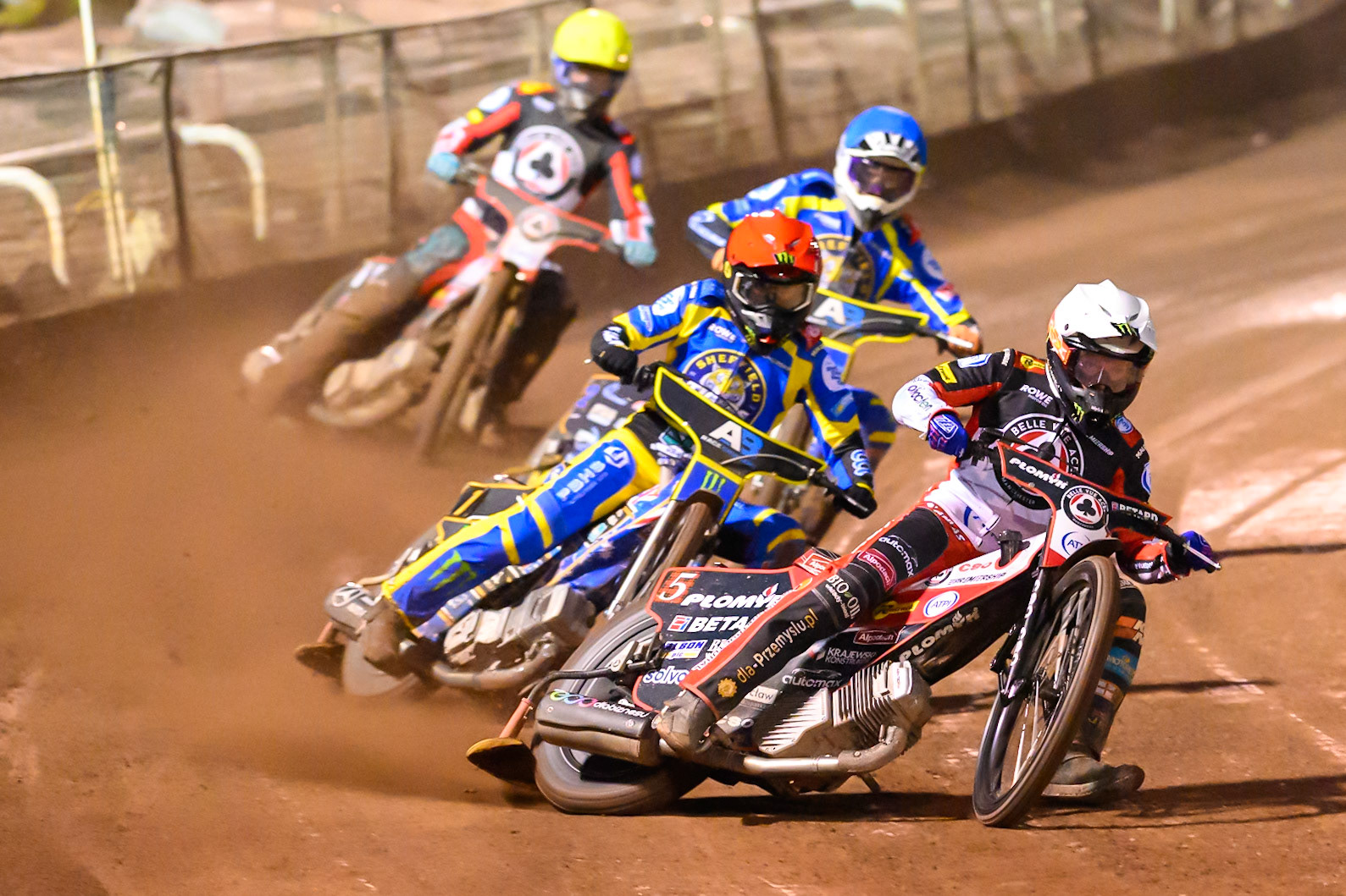 Dan Bewley of Belle Vue Aces in White leading Jack Holder of Sheffield Tigers   in Red Anders Rowe of Sheffield Tigers in Blue and Tate Zischke of Belle Vue Aces in Yellow during the Knockout Cup Northern Section match between Sheffield Tigers and Belle Vue Aces at Owlerton Stadium, Sheffield on Thursday 2nd April 2026. (Photo: Ian Charles | MI News)