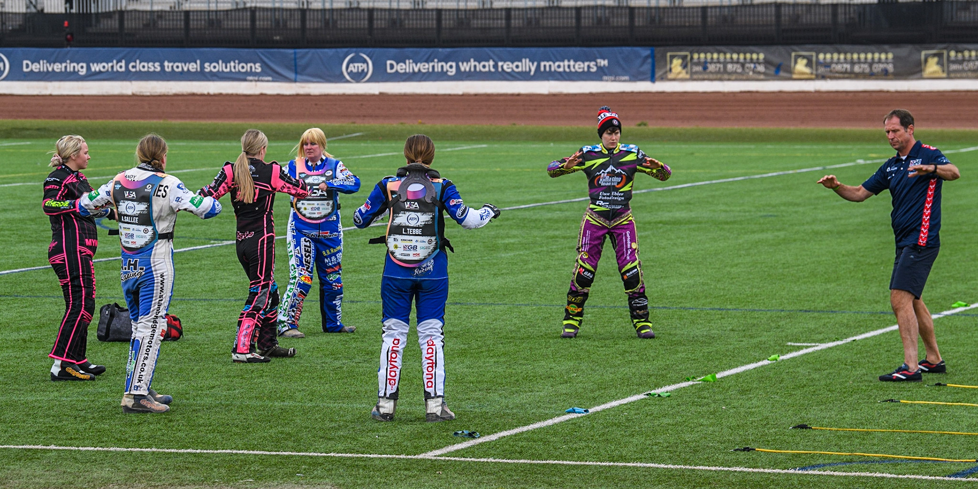 Riders do some warm up exercises during the FIM Women's  Speedway Academy at the National Speedway Stadium, Manchester on Friday 4th August 2023. (Photo: Ian Charles | MI News)