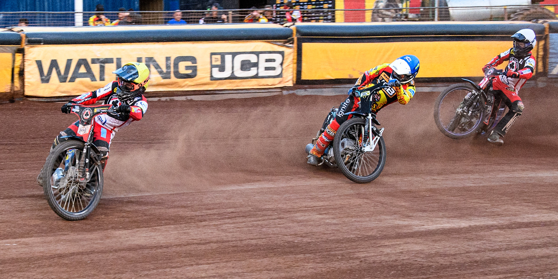 Belle Vue Aces' Ben Cook in Yellow leading Leicester Lions' Ryan Douglas in Blue  as Belle Vue Aces' Brady Kurtz in White picks up some drive during the Rowe Motor Oil Premiership match between Leicester Lions and Belle Vue Aces at the Pidcock Motorcycles Arena, Leicester on Thursday 25th July 2024. (Photo: Ian Charles | MI News)