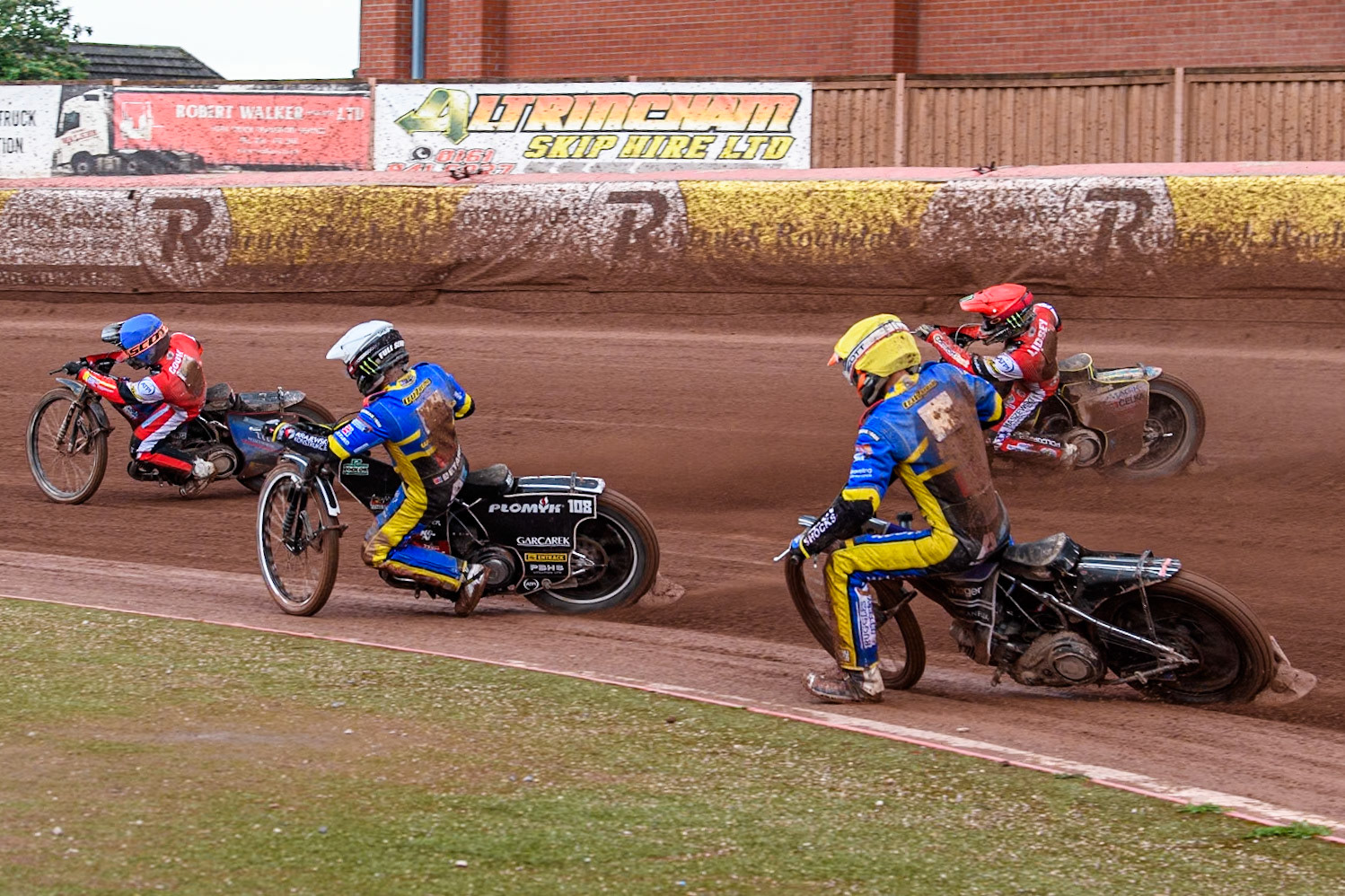 Sheffield Tigers' Jason Edwards in Yellow chases Sheffield Tigers' Tai Woffinden in White, Belle Vue Aces' Jaimon Lidsey in Red and Belle Vue Aces' Ben Cook in Blue during the Rowe Motor Oil Premiership match between Belle Vue Aces and Sheffield Tigers at the National Speedway Stadium, Manchester on Monday 27th May 2024. (Photo: Ian Charles | MI News)