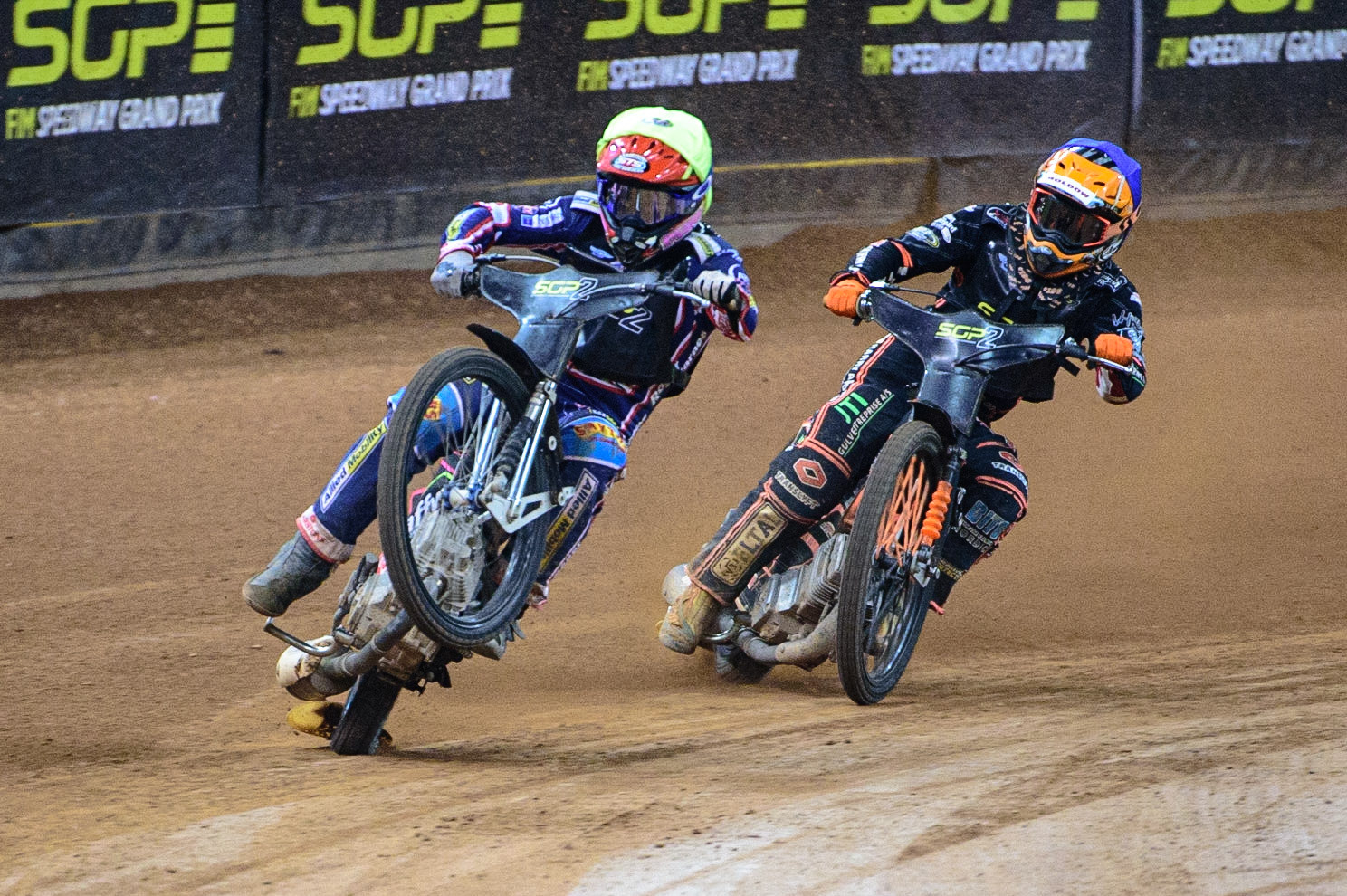 Leon Flint (Great Britain)  (Yellow) picks up some drive coming out of the corner ahead of Kevin Juhl Pedersen (Denmark) (Blue) during the FIM  Speedway Grand Prix  2 of Great Britain at the Principality Stadium, Cardiff on Sunday 14th August 2022. (Credit: Ian Charles | MI News)