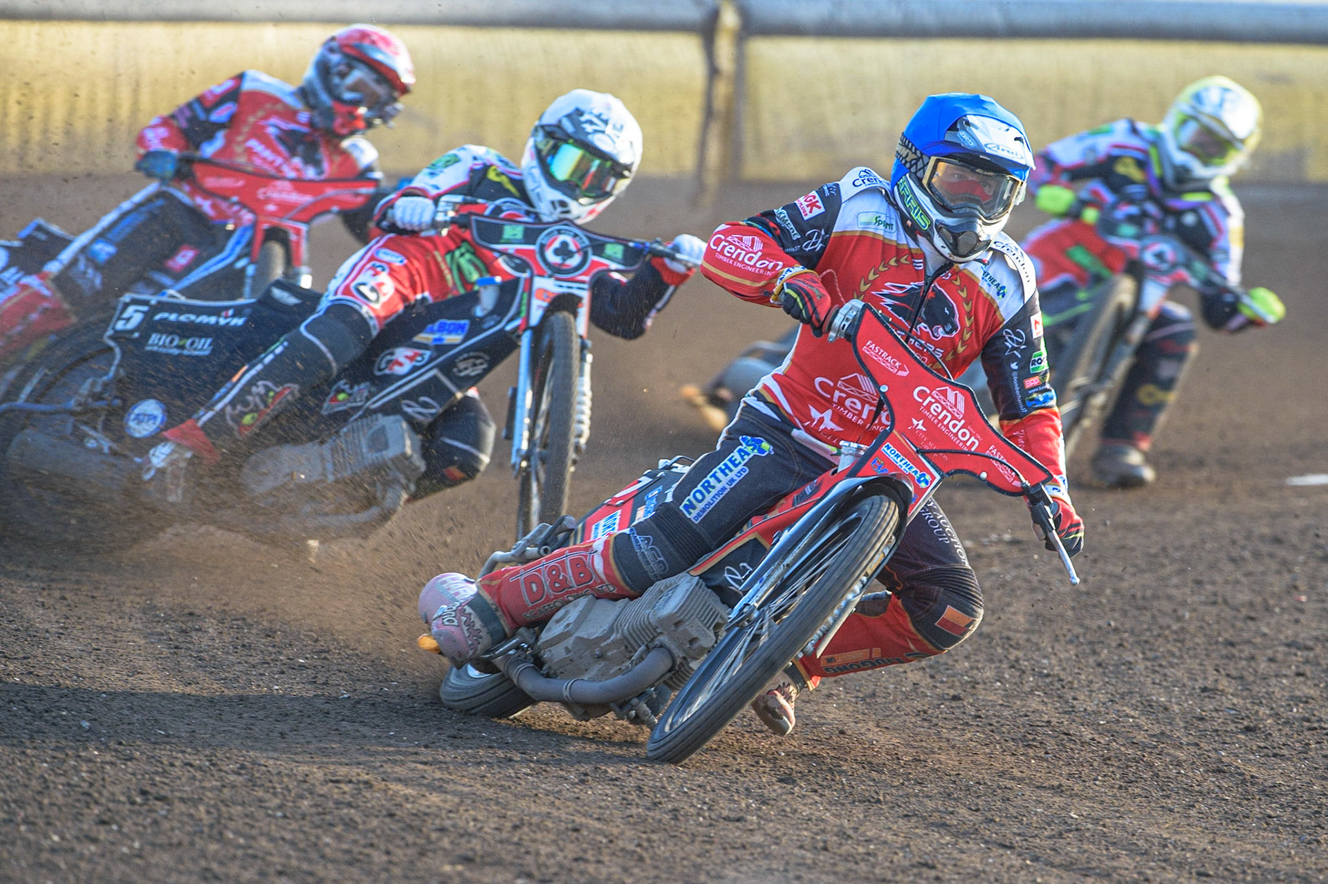 PETERBOROUGH, UK. JULY 19TH  Chris Harris (Blue) leads Dan Bewley  (White) Bjarne Pedersen  (Red) and Tom Brennan   (Yellow) during the SGB Premiership match between Peterborough and Belle Vue Aces at East of England Showground, Peterborough on Monday 19th July 2021. (Credit: Ian Charles | MI News)