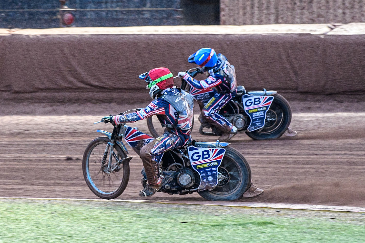 Leon Flint of Great Britain in Red inside team mate Sam Hagon of Great Britain in Blue during the Monster Energy FIM Speedway of Nations 2 (Under 21) Final at the National Speedway Stadium, Manchester on Friday 12th July 2024. (Photo: Ian Charles | MI News)