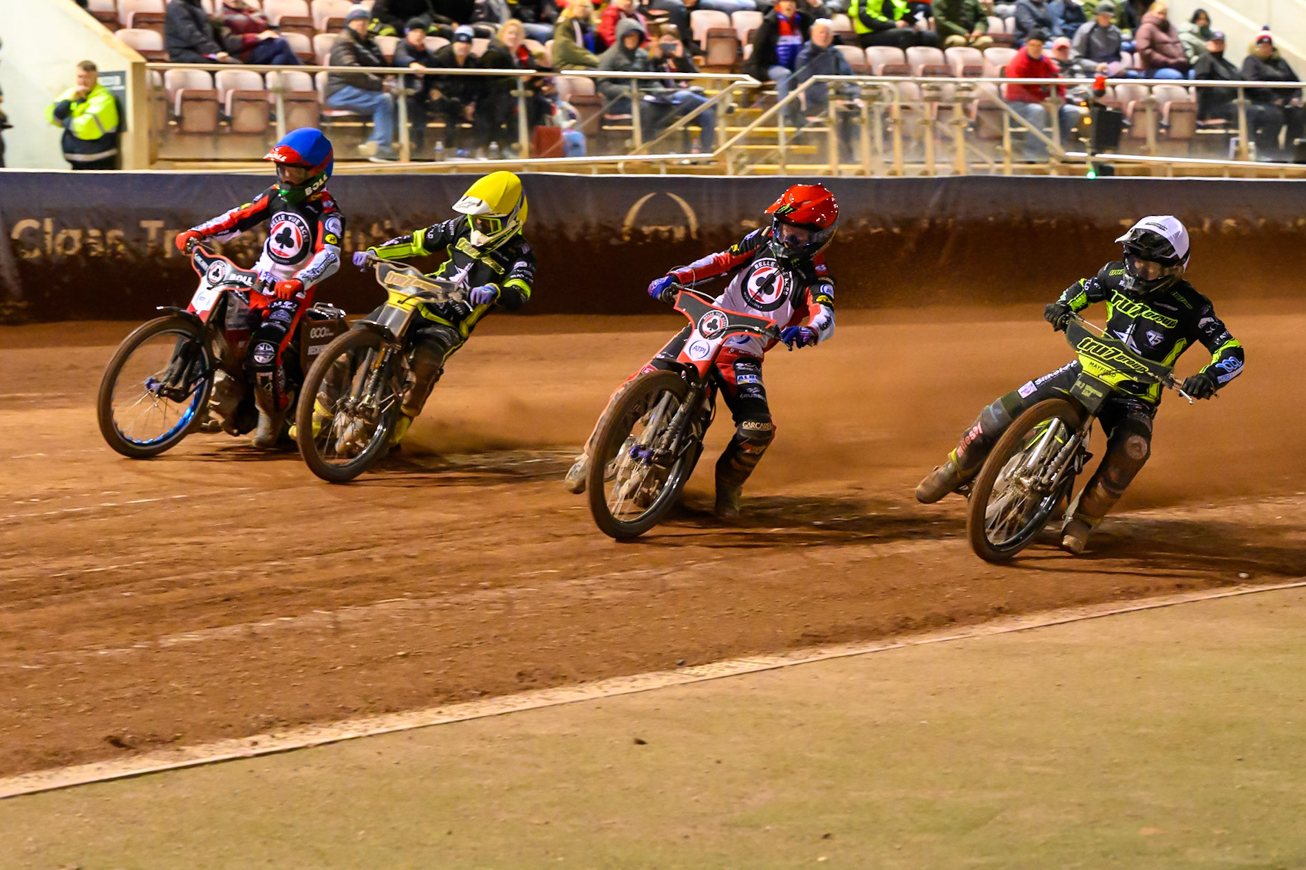Dan Bewley of Belle Vue Aces   in Red rides outside Danny King of Ipswich Witches  in White with Tom Brennan of Ipswich Witches  in Yellow and Brady Kurtz of Belle Vue Aces during the Rowe Motor Oil Premiership match between Belle Vue Aces and Ipswich Witches at the National Speedway Stadium, Manchester on Monday 20th April 2026. (Photo: Ian Charles | MI News)